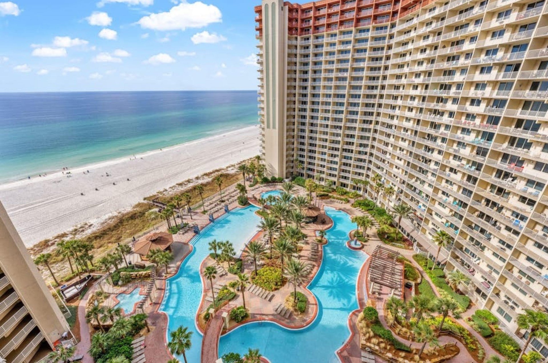 Aerial view of the courtyard pool area next to the beach at Shores of Panama Resort in Panama City Beach Florida