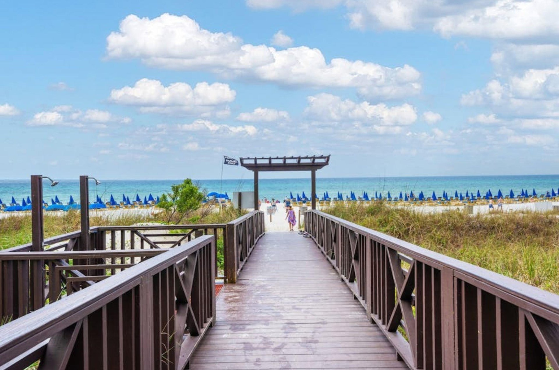 A wooden boardwalk leading to the beach at the Shores of Panama Resort