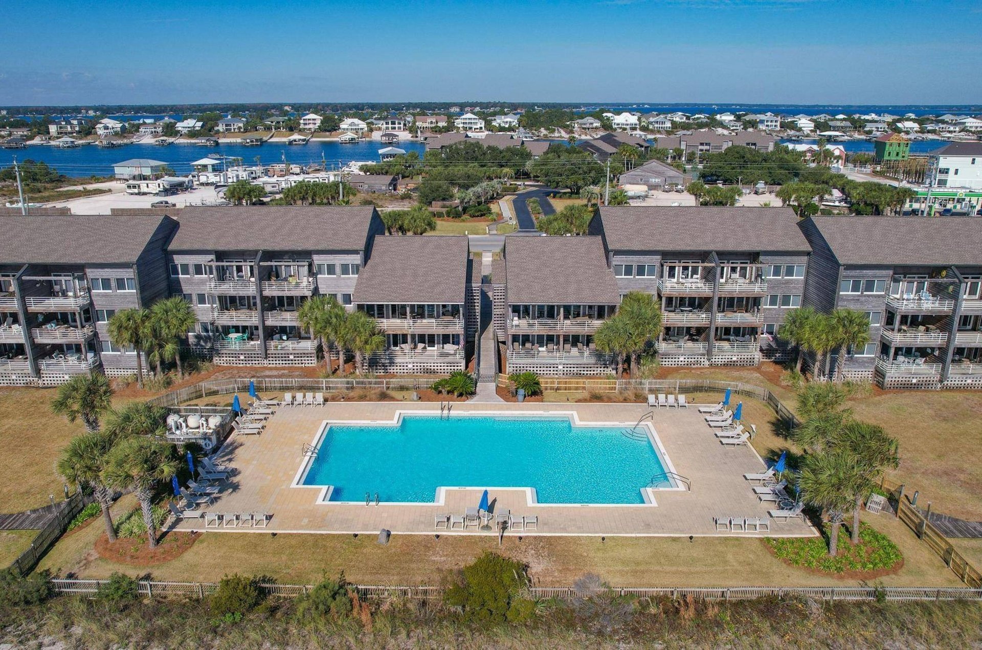 Aerial view of the swimming pool and condominiums at Needle Rush Point