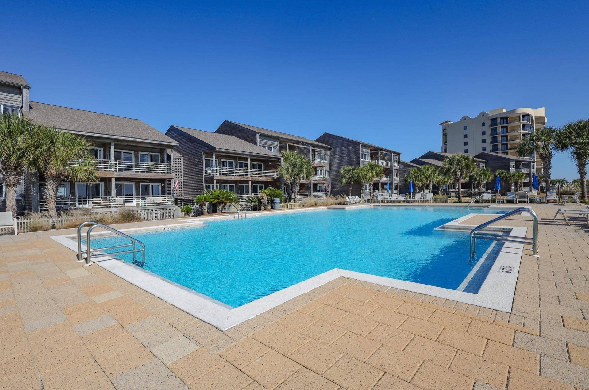 The Gulf side of Needle Rush Point boasts an outdoor pool and boardwalk down to the spectacular beaches