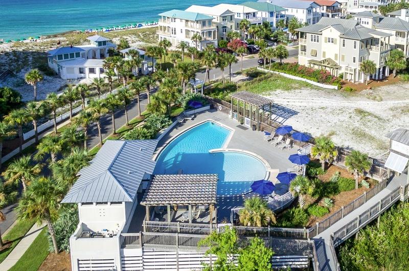Community swimming pool in the foreground and the Gulf in the background
