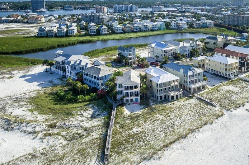 A beach lines the community