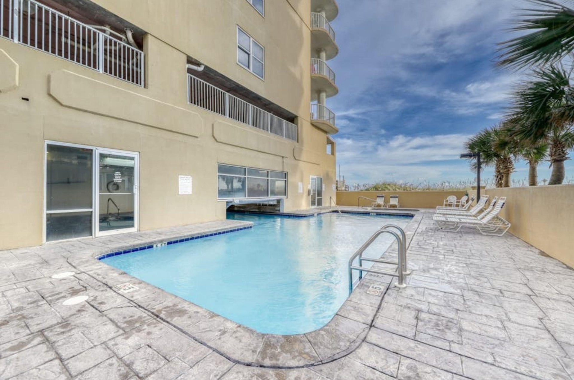 Relax by the beachfront swimming pool at Island Royale