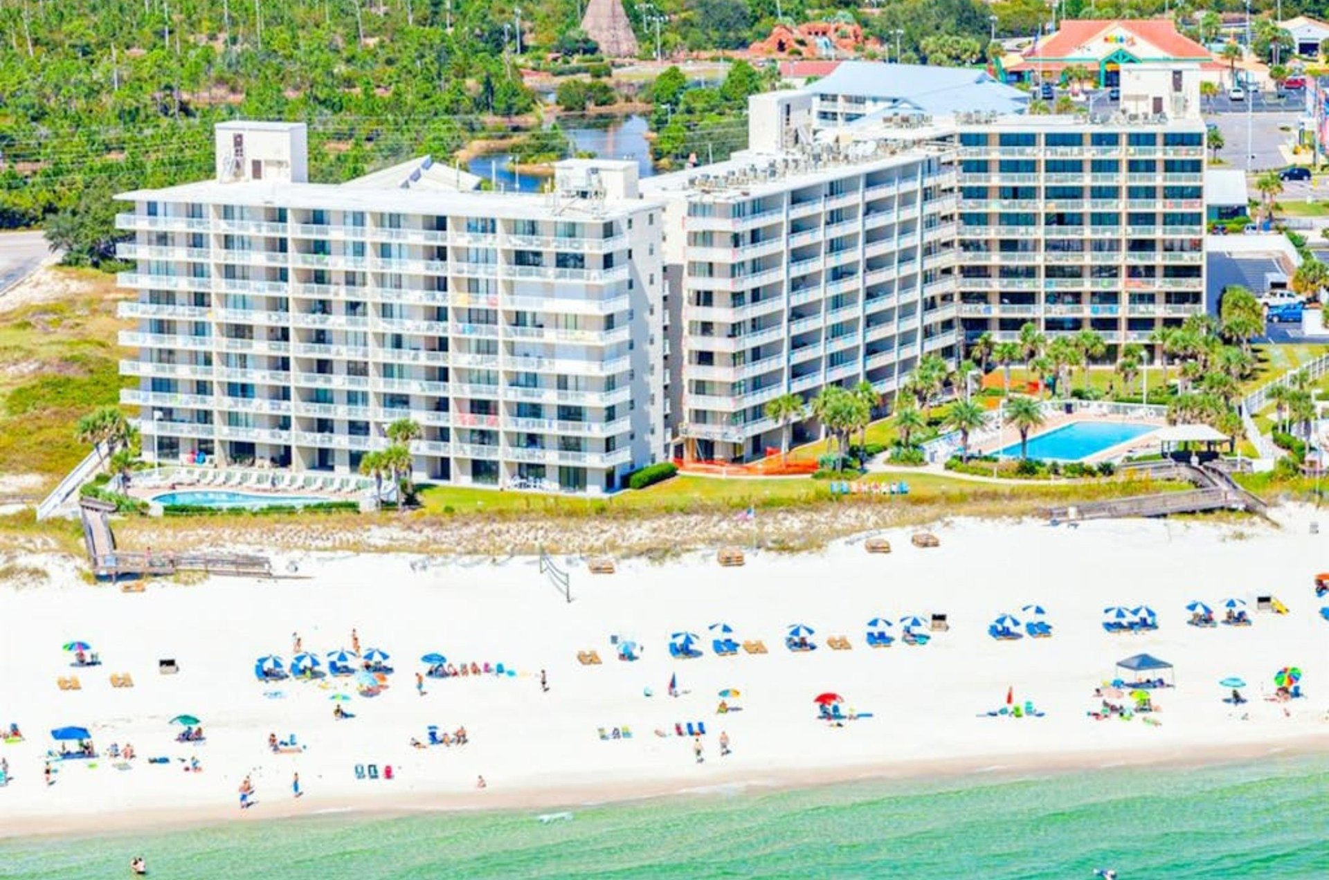 Aerial view of Seaside Beach and Racquet Club on the beach in Orange Beach Alabama