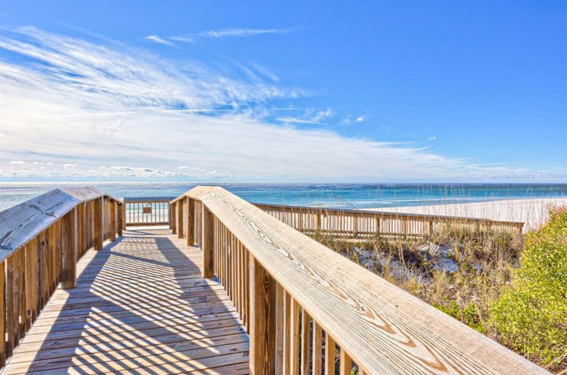 A boardwalk leading to the Gulf at Seaside Beach and Racquet Club in Orange Beach Alabama