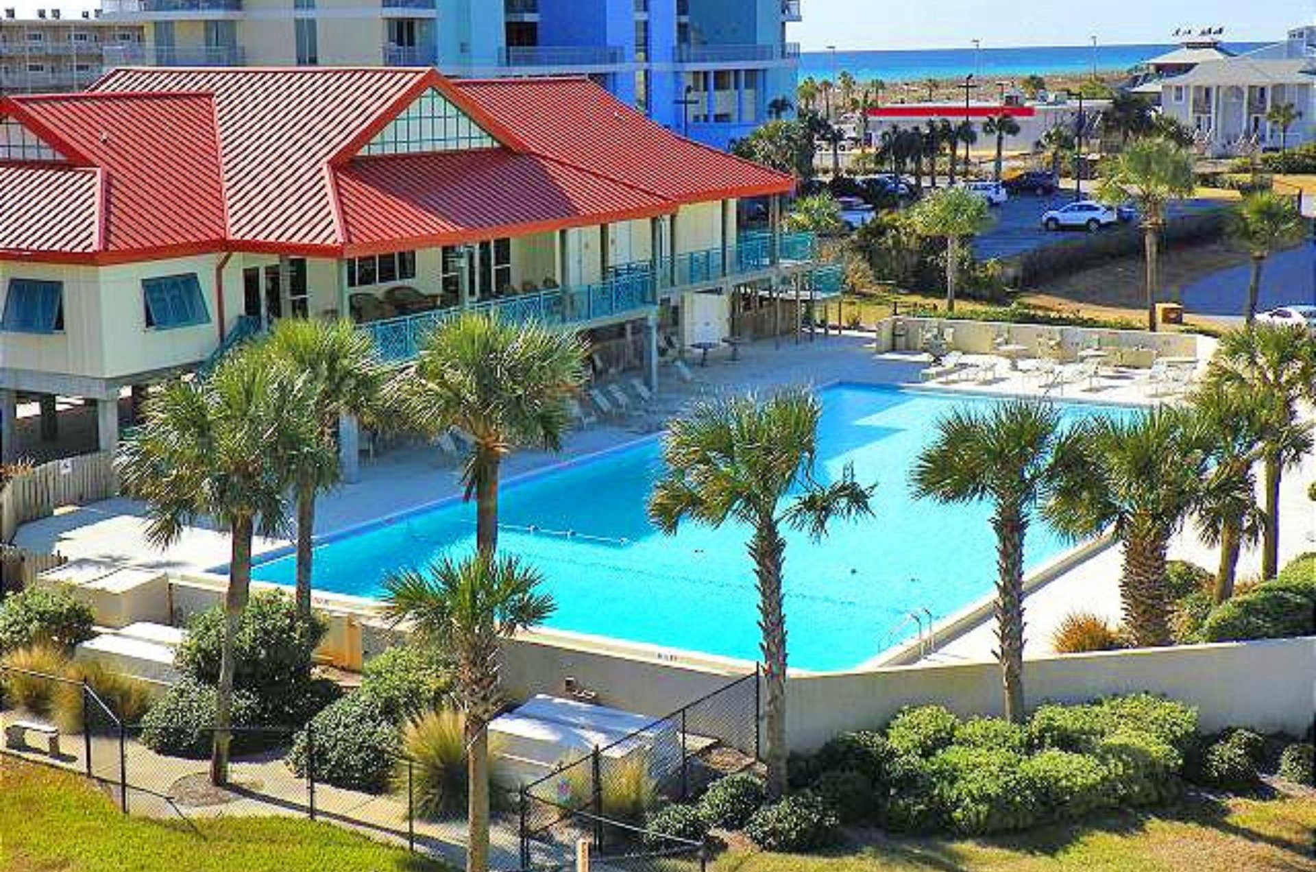 Lounge by the spacious outdoor pool and clubhouse