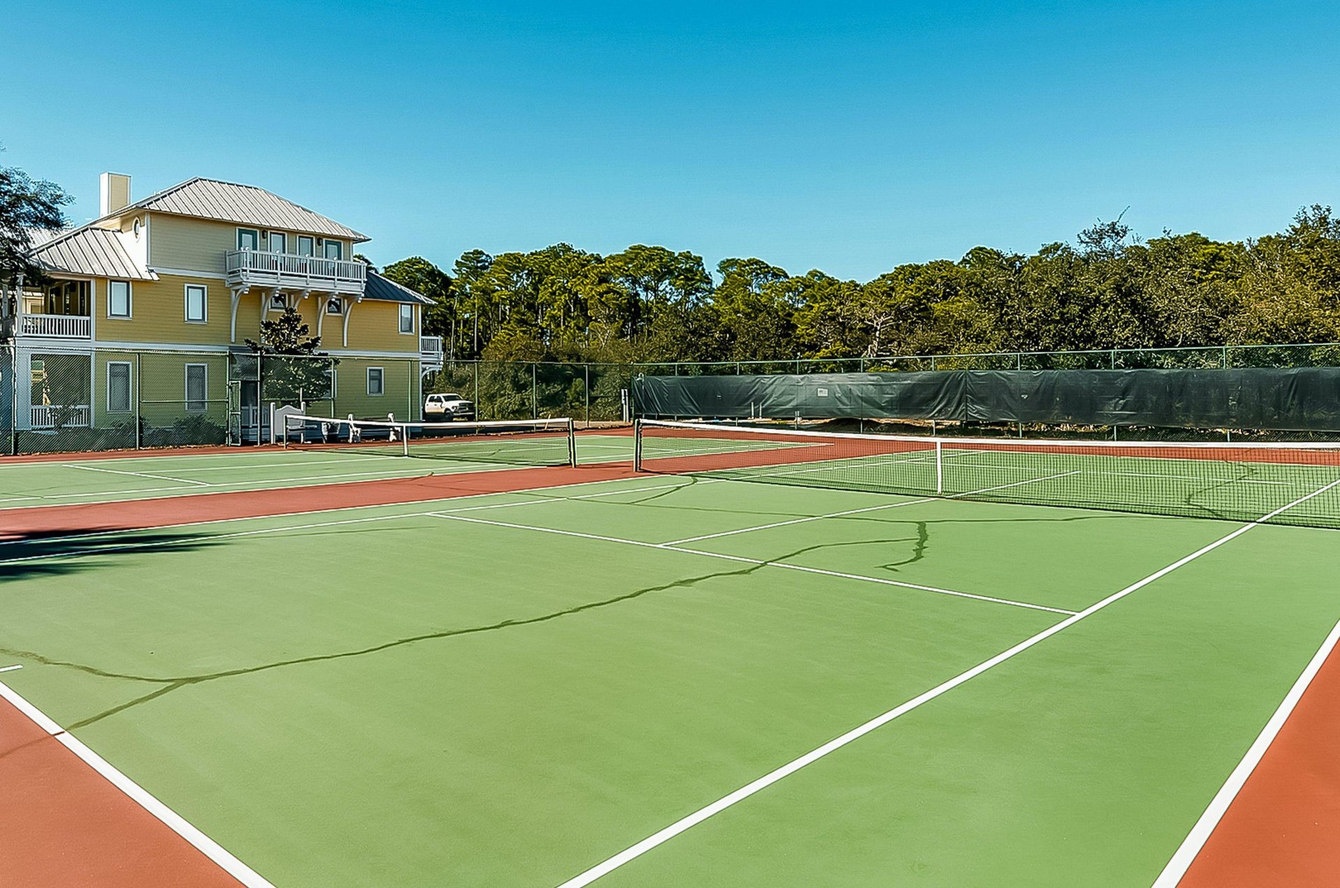 The Carillon Beach community boasts outdoor tennis courts for guests