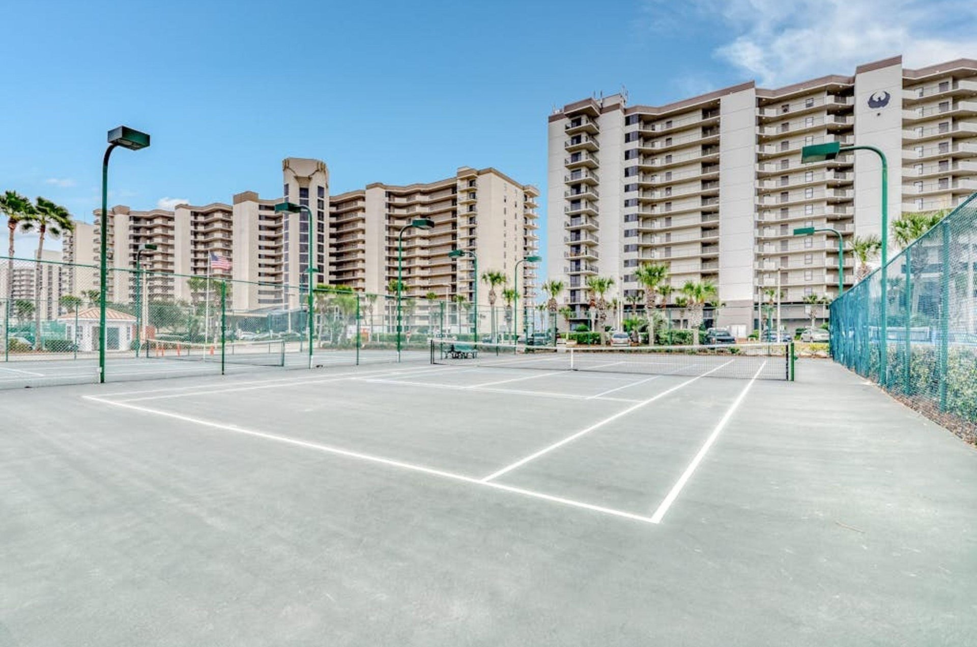 The outdoor tennis courts in front of Phoenix VI in Orange Beach Alabama