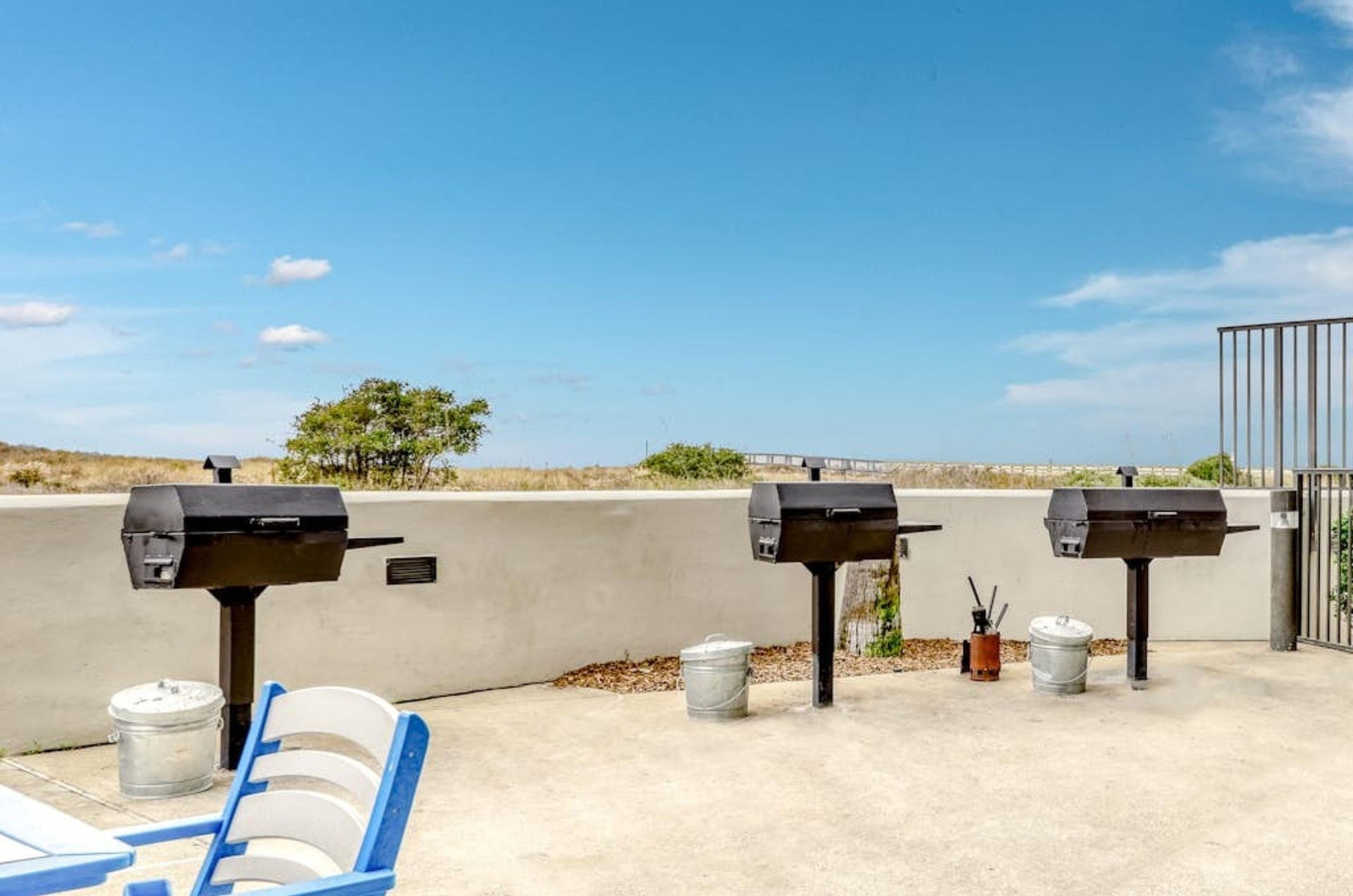 Outdoor charcoal grils next to the beach at Phoenix in Orange Beach Alabama