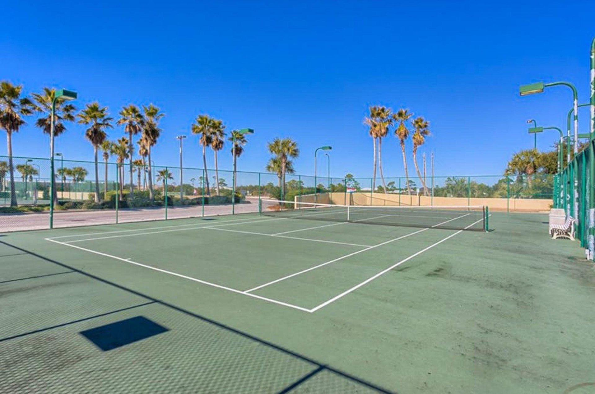 The outdoor tennis courts at Phoenix VII in Orange Beach Alabama