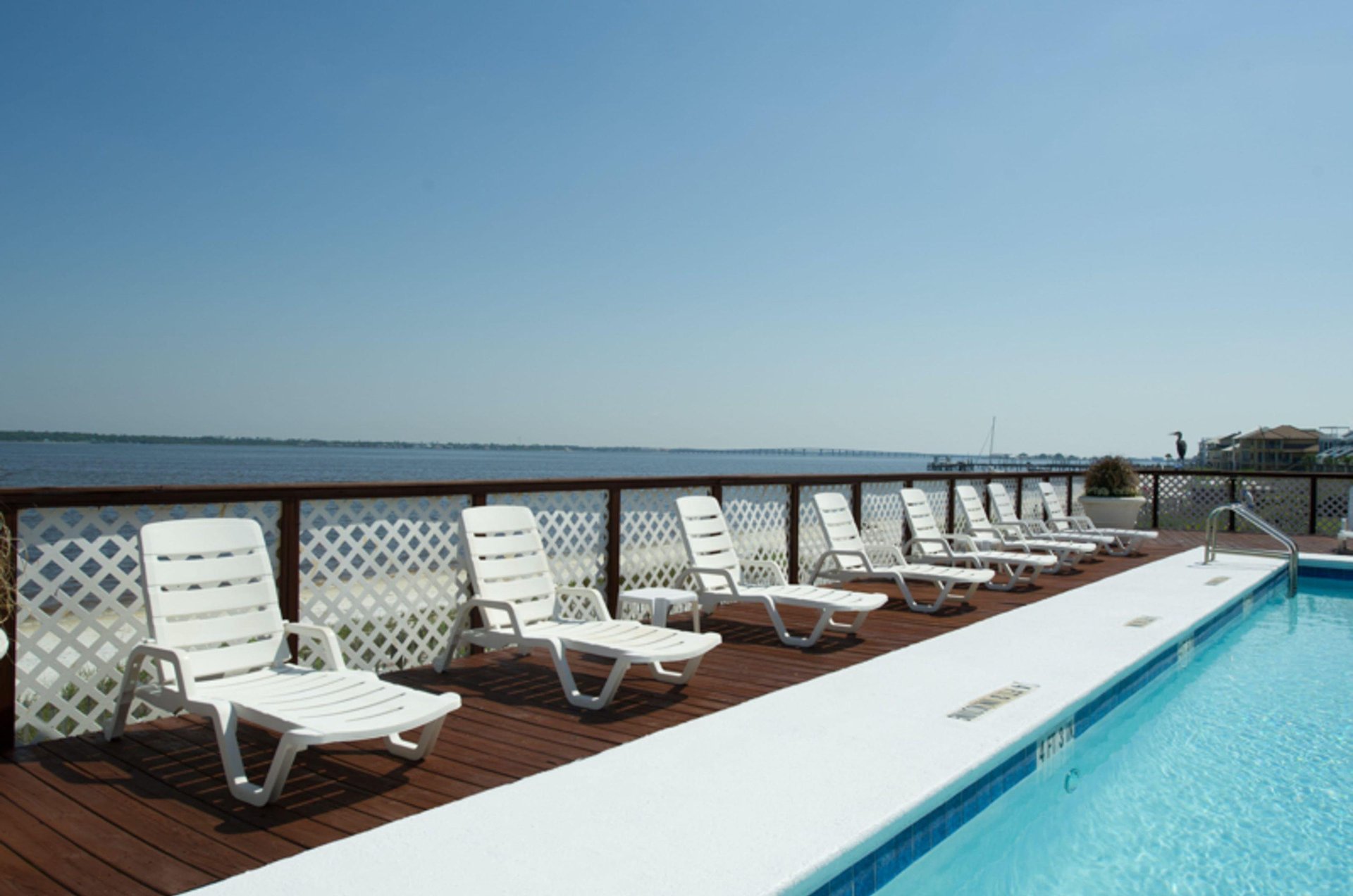 Beachside lounge chairs by the outdoor pool
