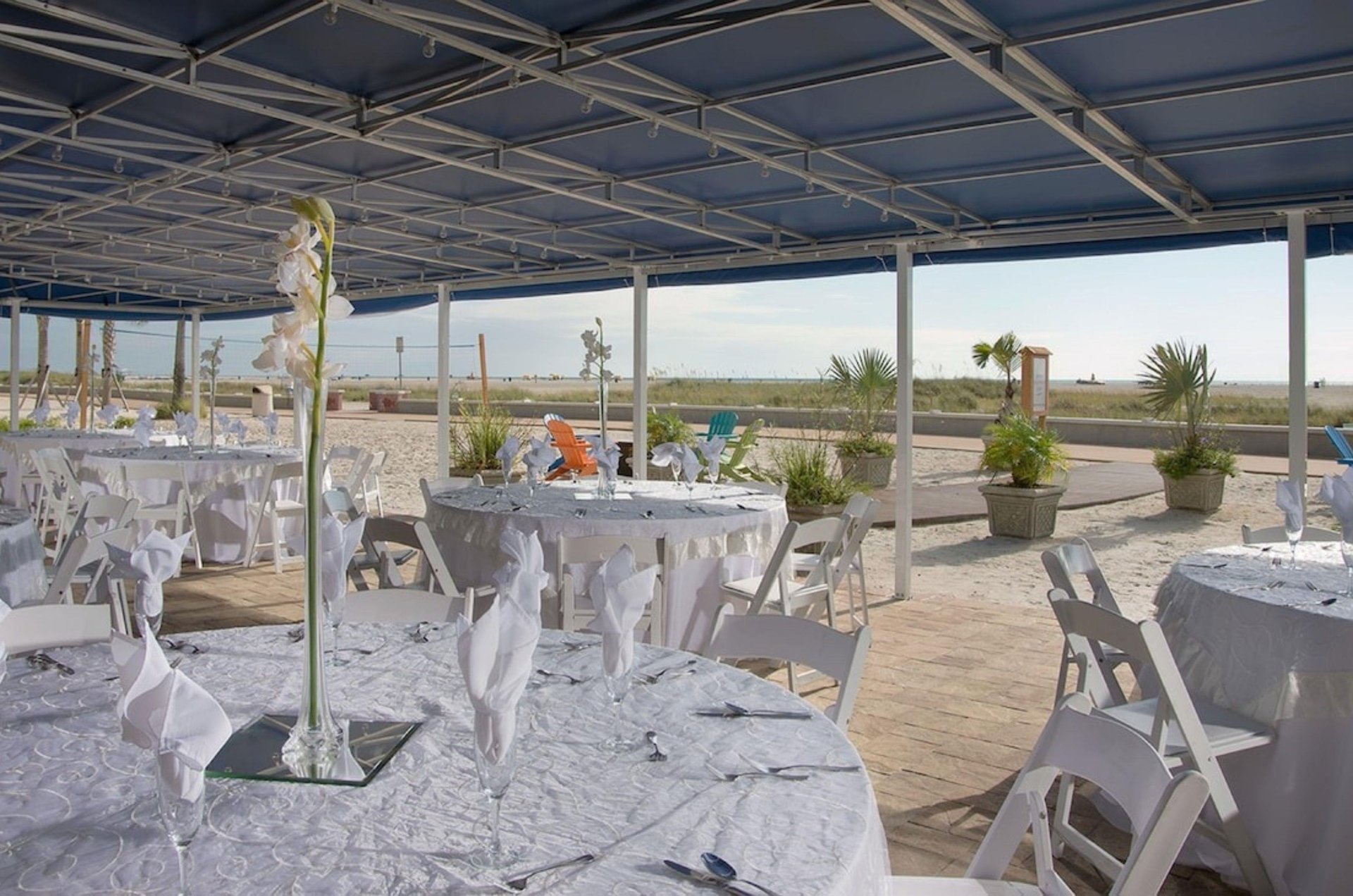 Elegant table settings in the beachside outdoor event space