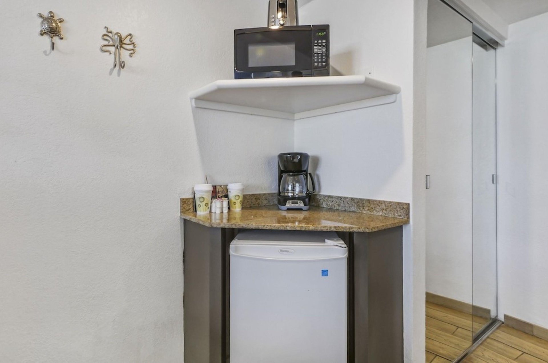 The inroom kitchenette with a microwave minifridge and coffee machine