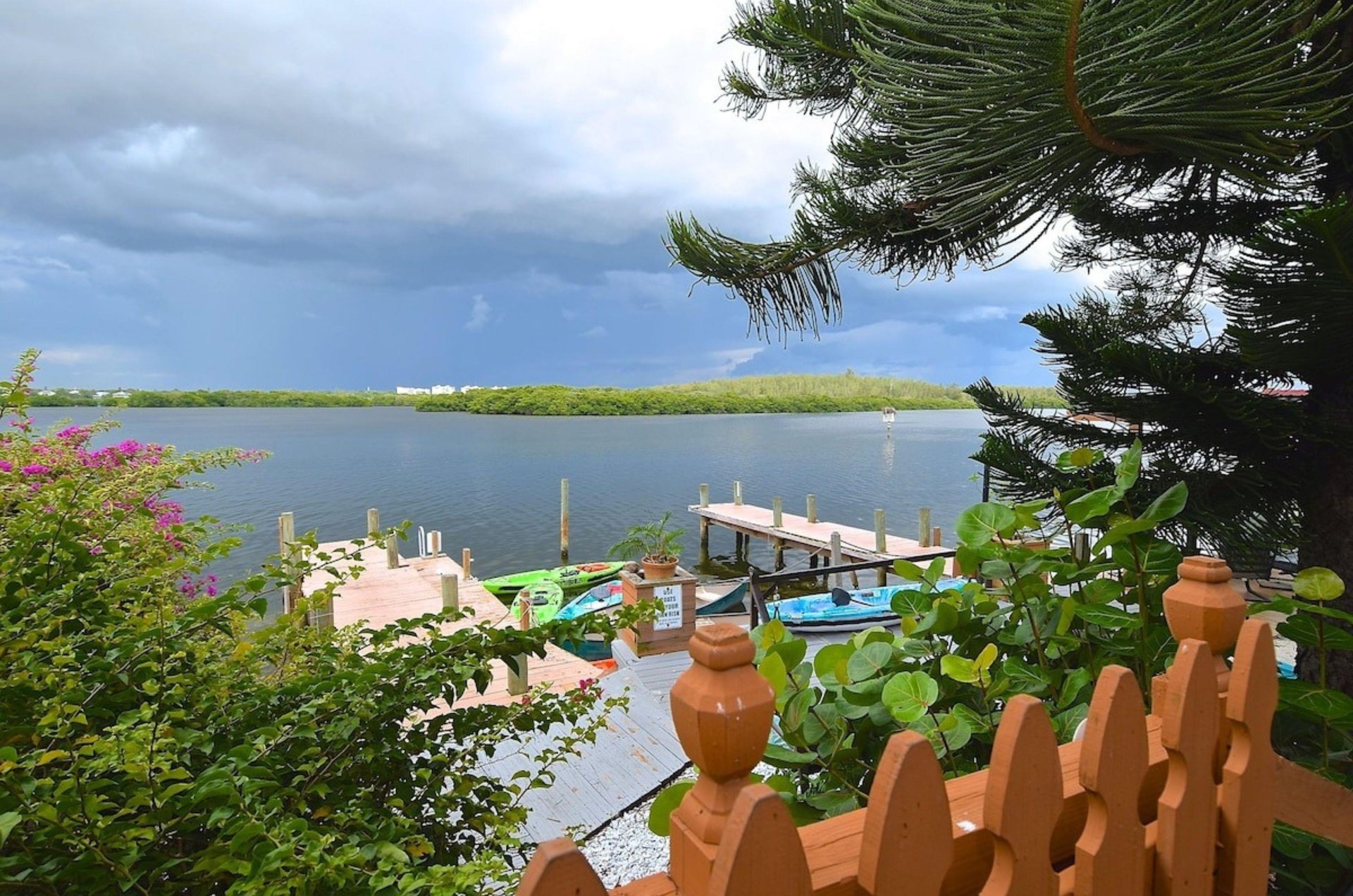 View of the water and the outdoor pool from a private patio