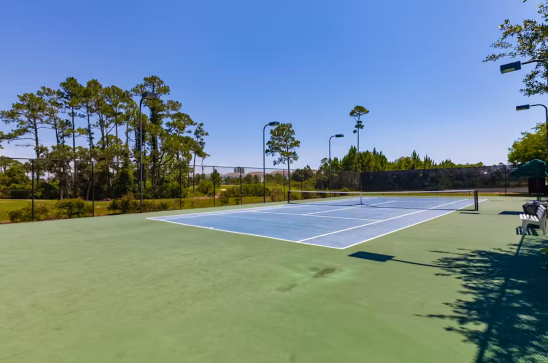 The outdoor tennis courts at Lost Key Golf and Beach Club