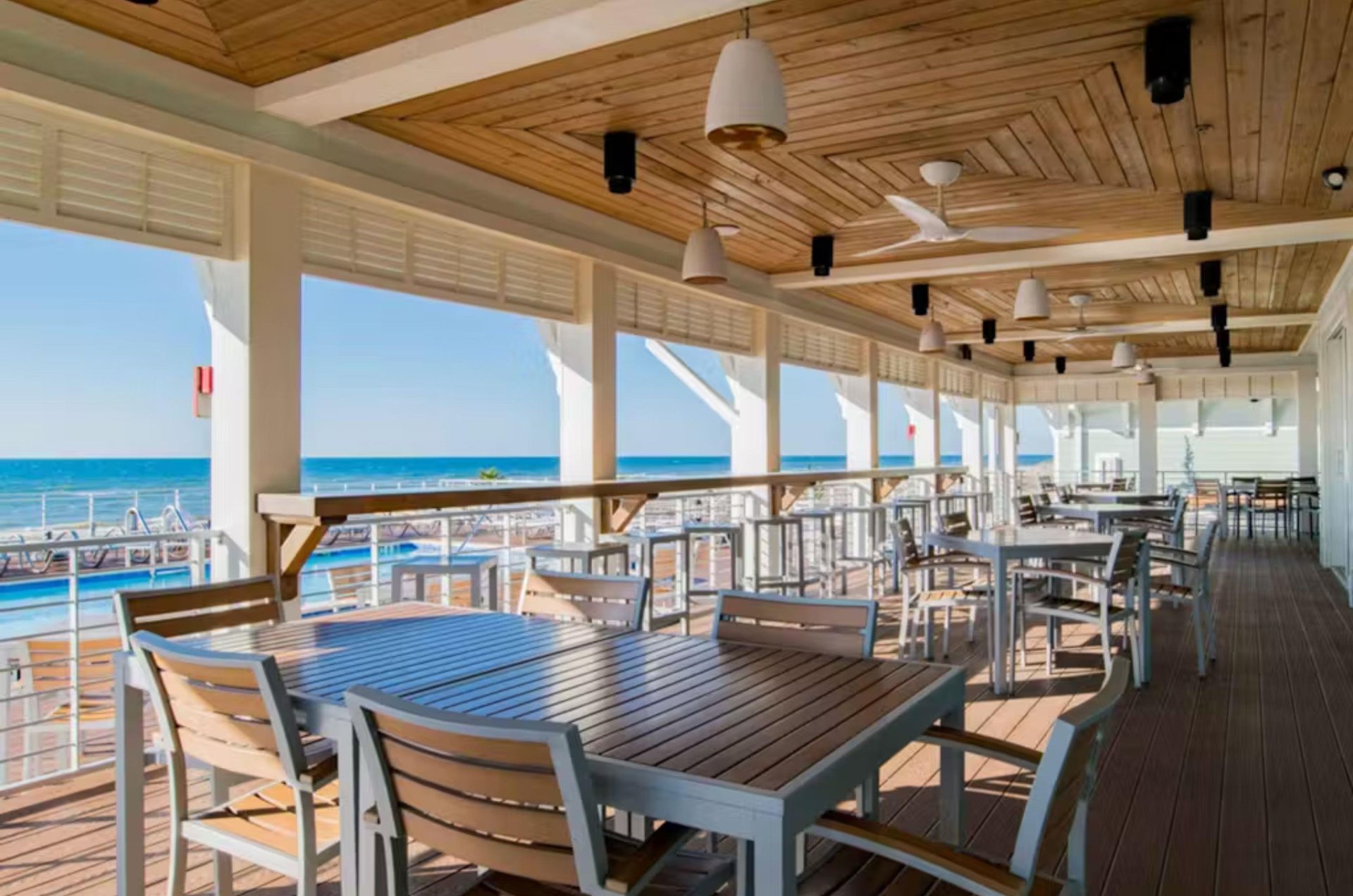 Outdoor covered seating at the Gulffront Beach Club restaurant