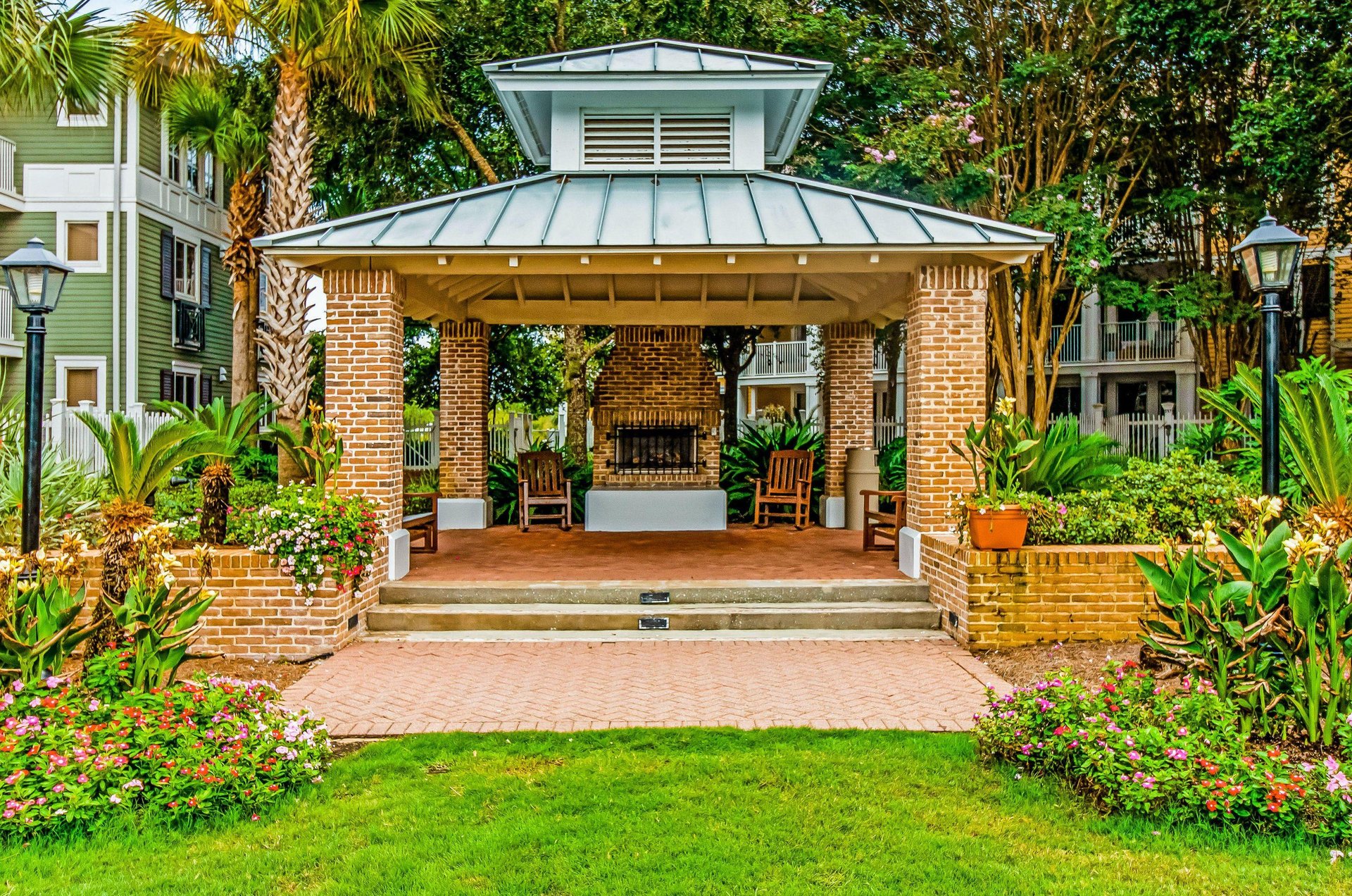 A pavilion with a fireplace and rocking chairs