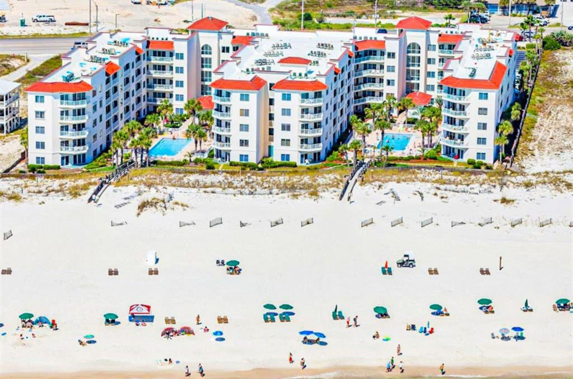 Birds eye view of Palm Beach Condos next to the beach in Orange Beach Alabama