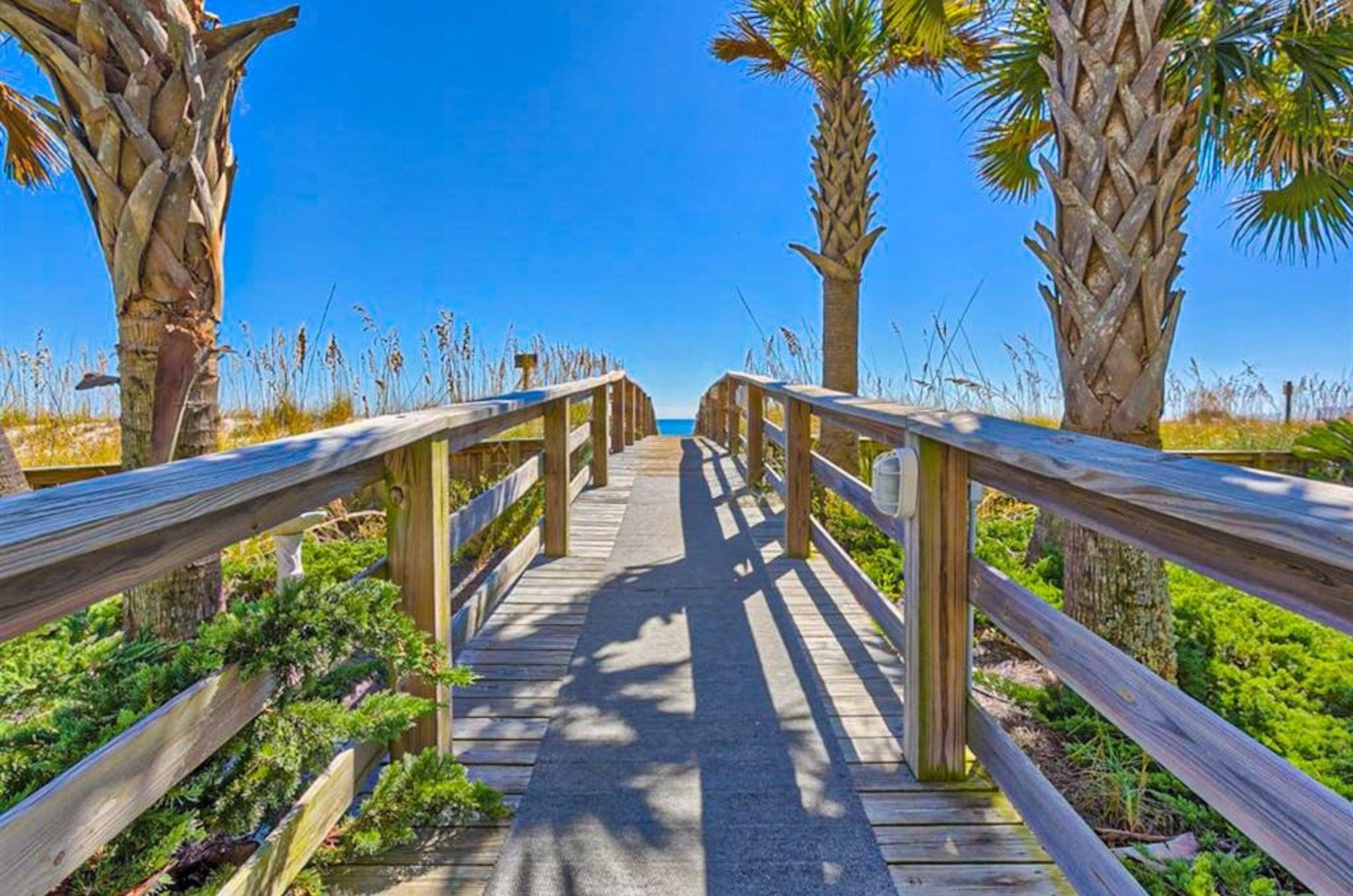 A boardwalk leading to the Gulf at Palm Beach Condos in Orange Beach Alabama