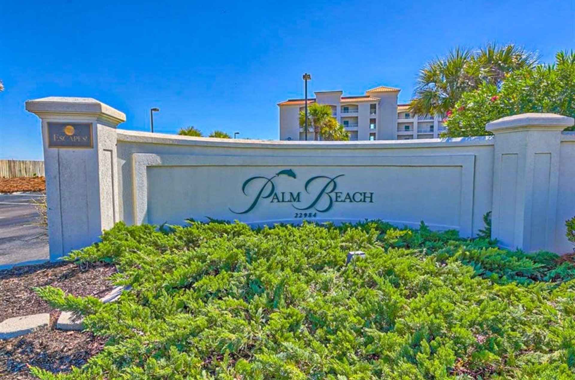 The entrance sign to Palm Beach Condos in Orange Beach Alabama