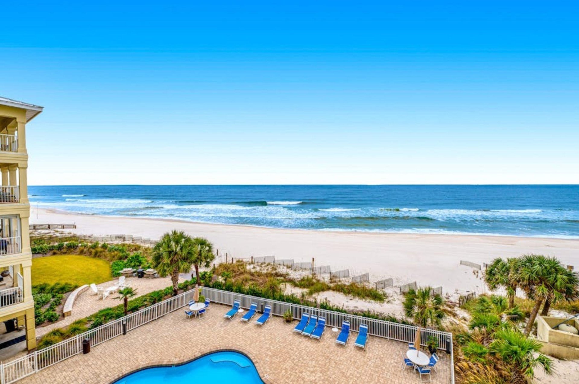 View from a balcony of the swimming pool and beach at Marlin Key in Orange Beach Alabama