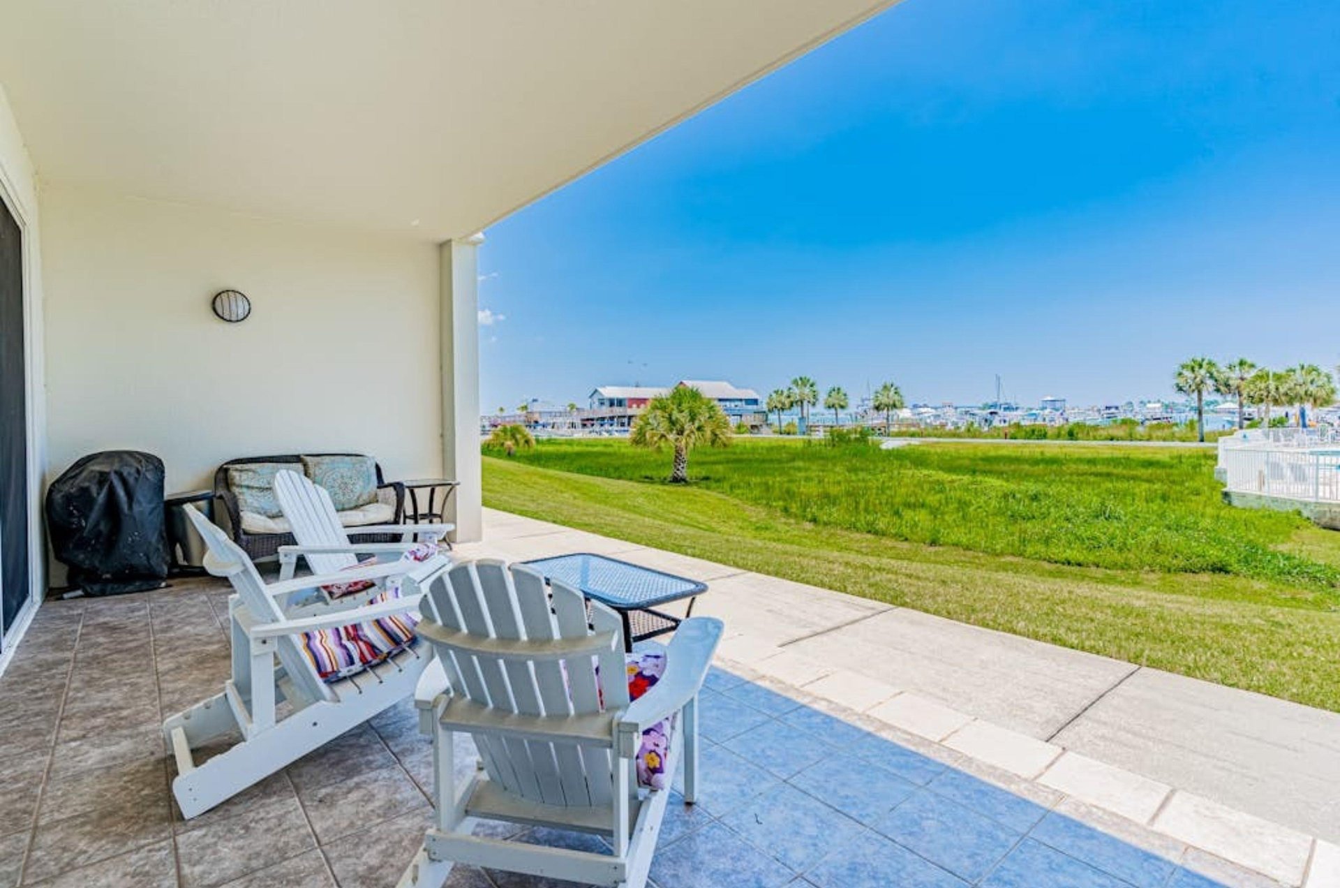 A private balcony with two lounge chairs at Harbor Cove in Orange Beach Alabama