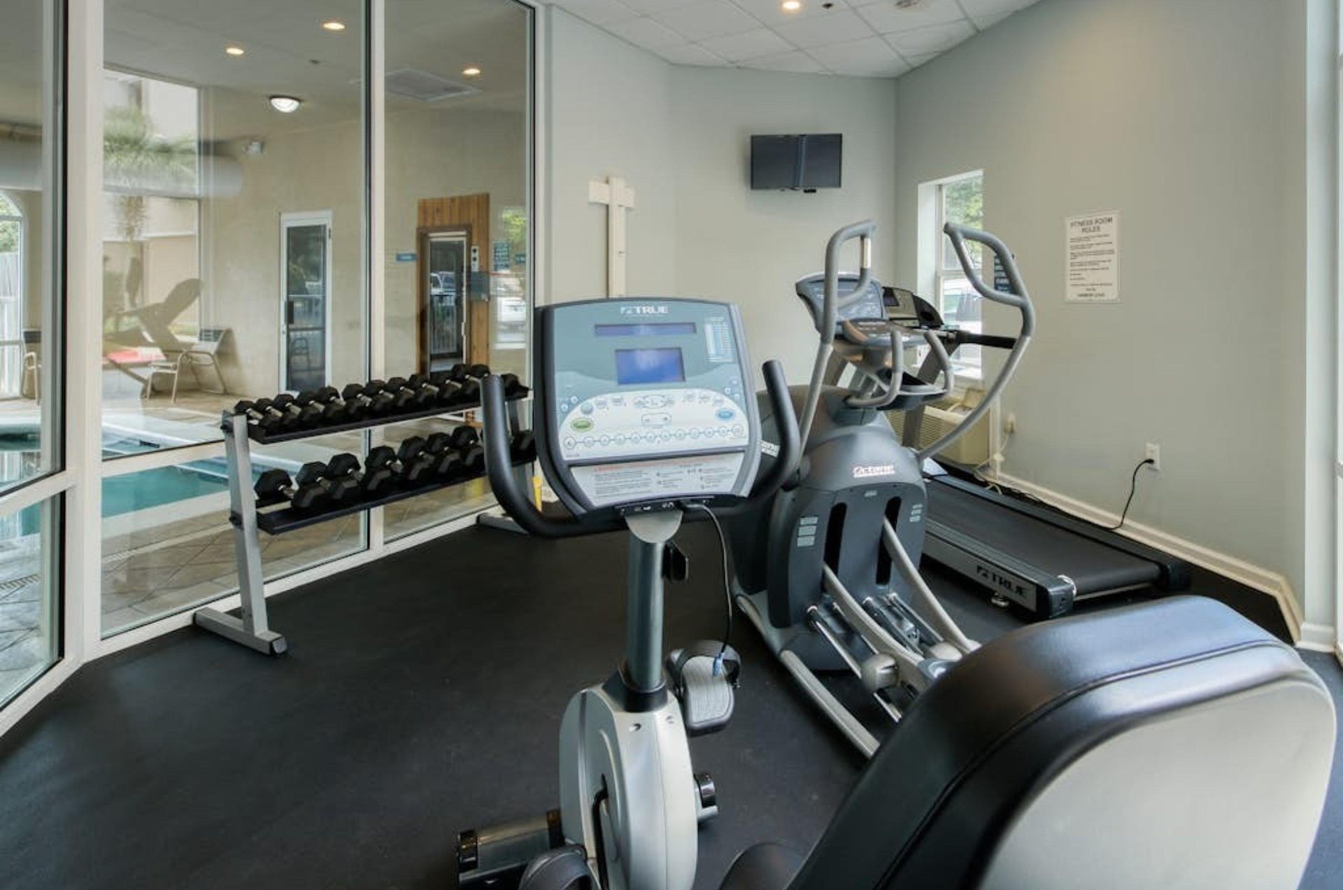 The gym with free weights and cardio equipment at Harbor Cove in Orange Beach Alabama