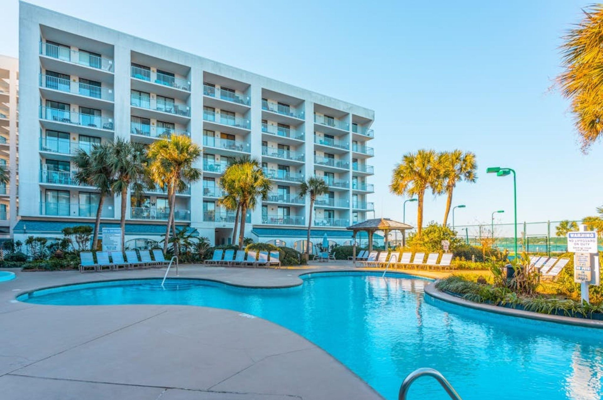 The large outdoor swimming pool in front of Gulf Shores Surf and Racquet Club in Gulf Shores Alabama