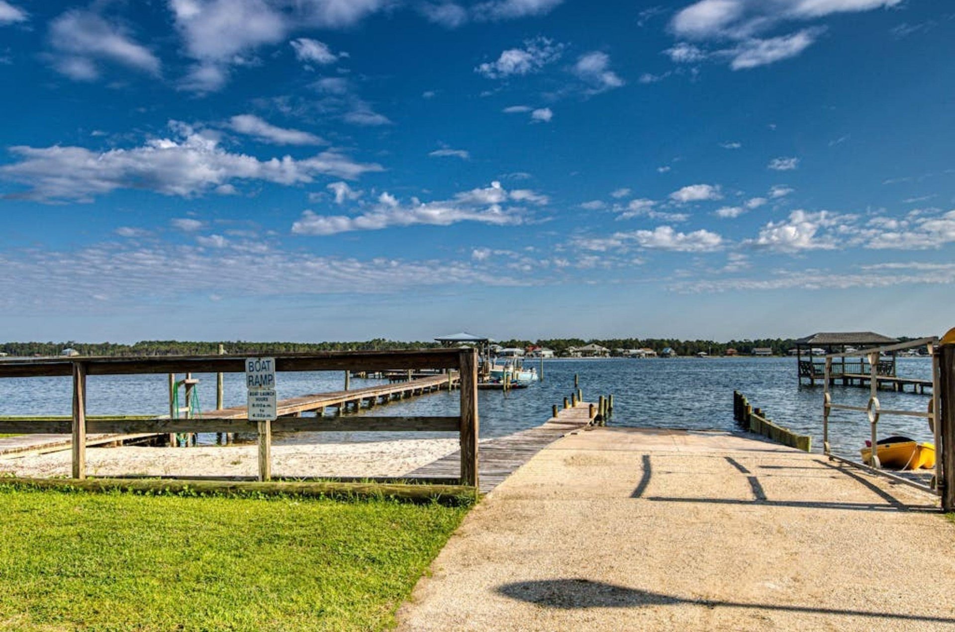 The boat ramp and wooden dock on Little Lagoon at Gulf Shores Surf and Racquet Club in Gulf Shores Alabama