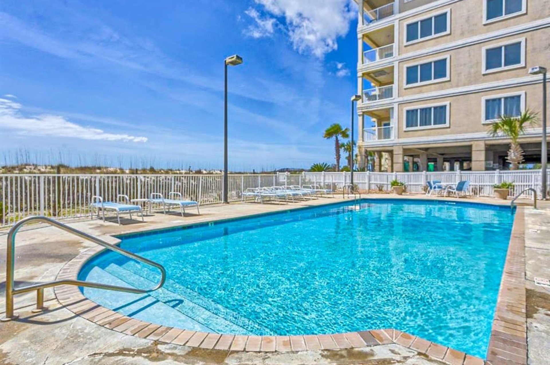 The crystal clear beachside swimming pool at Dolphin Key in Orange Beach Alabama
