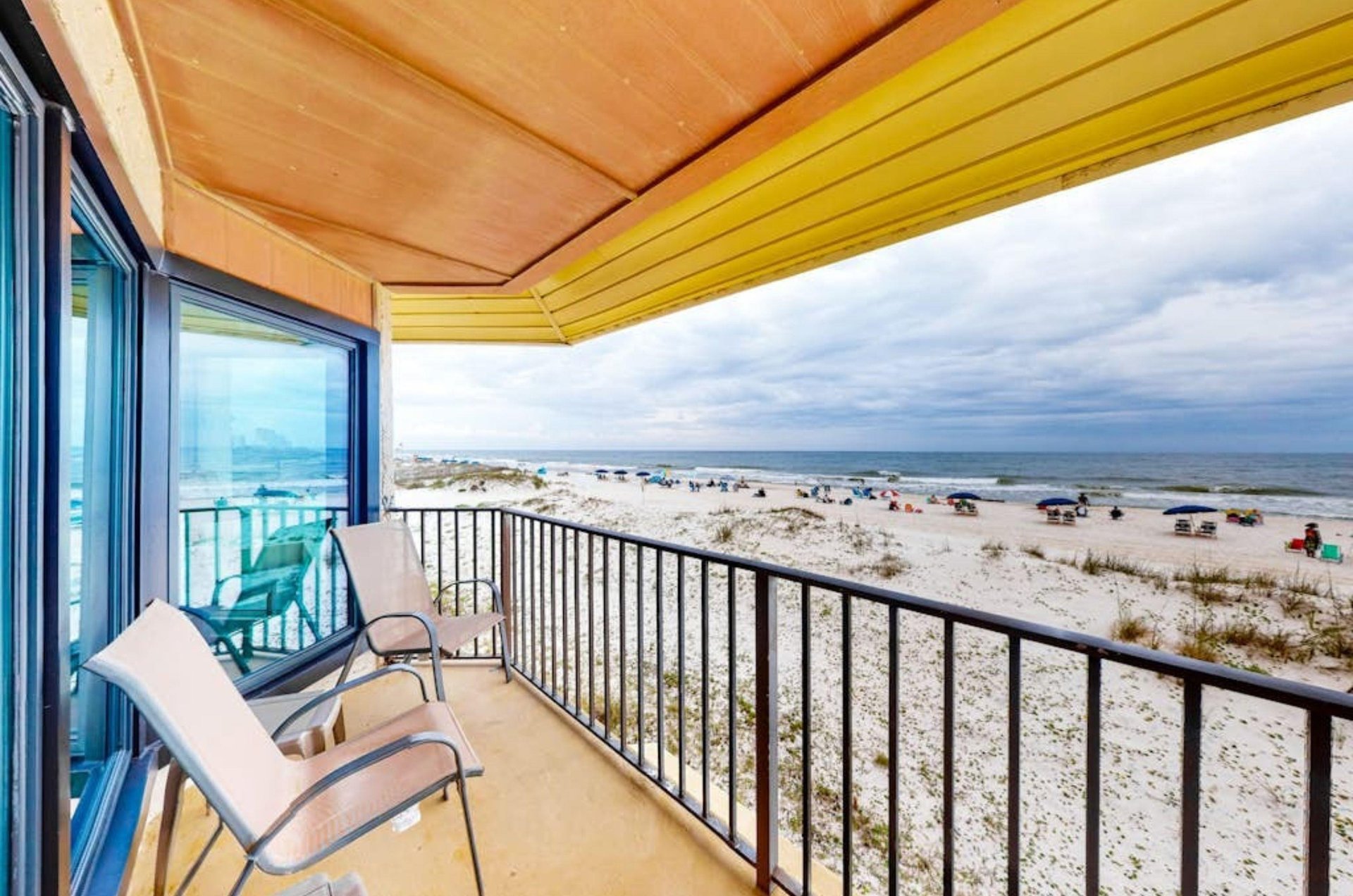 A chair on a private balcony overlooking the Gulf of Mexico at Gulfside Townhomes