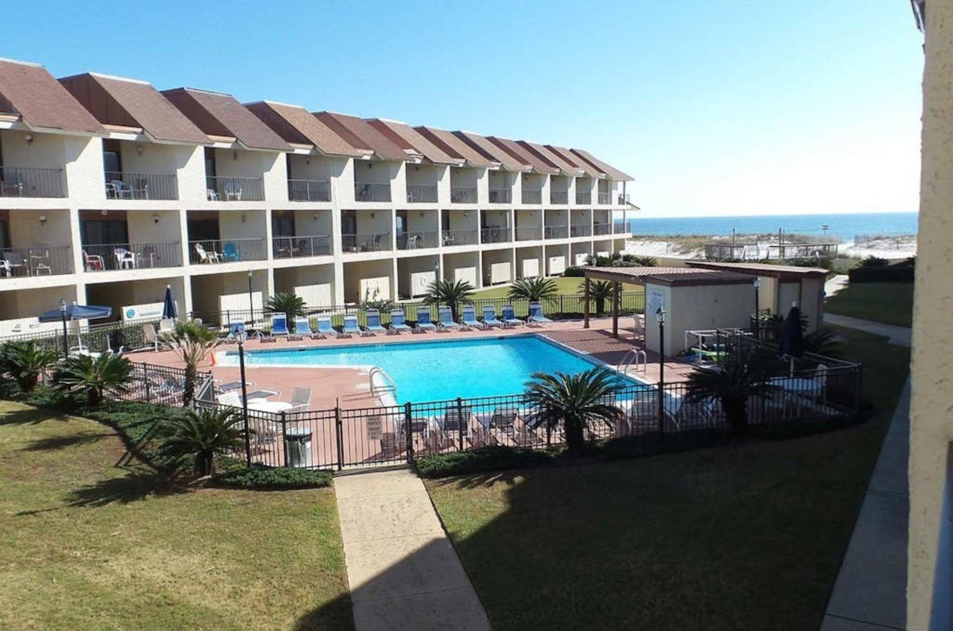 Soak up some sun on the beachfront pool deck at Gulfside Townhomes