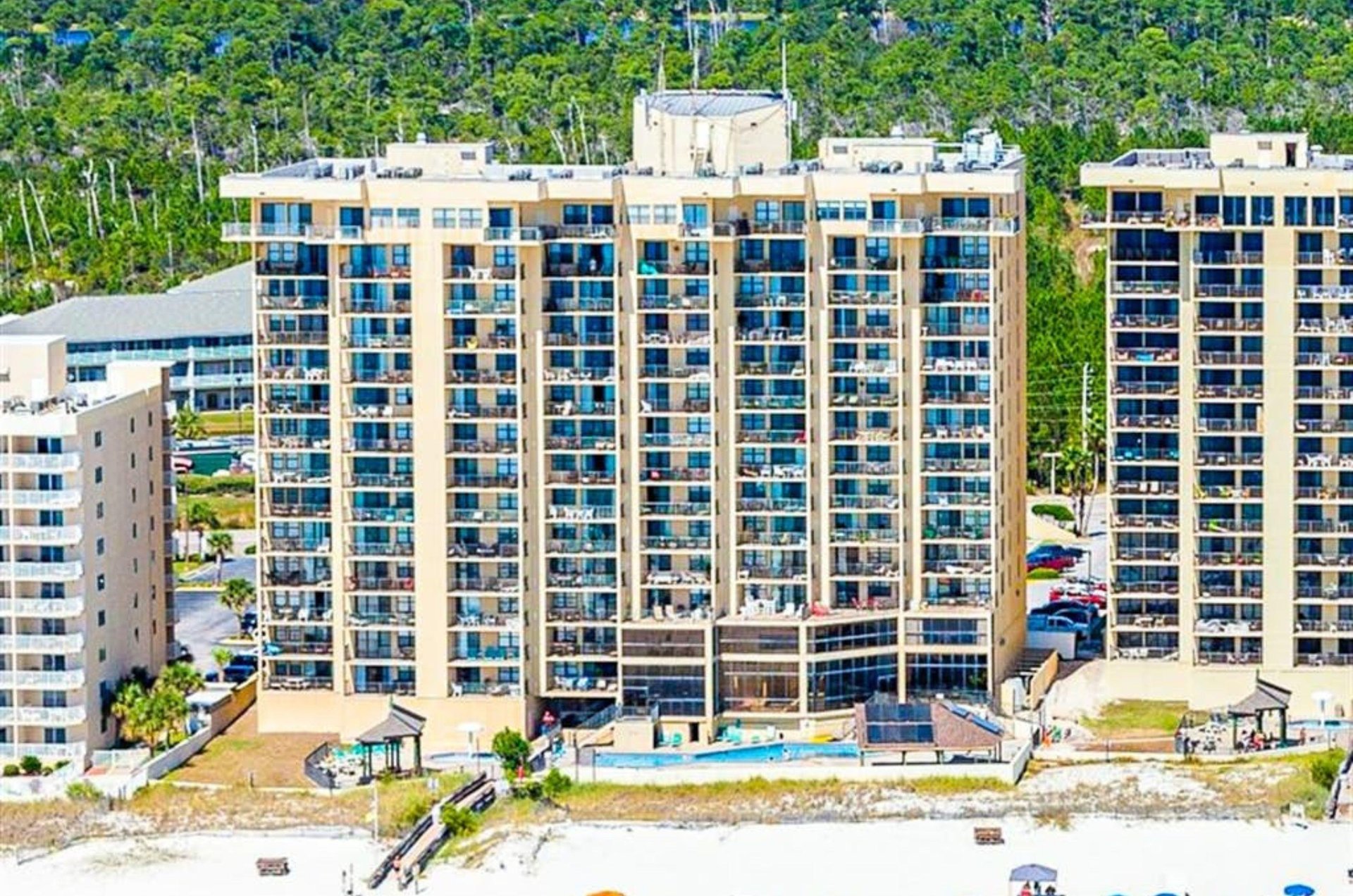 Aerial view of Phoenix I next to the beach in Orange Beach Alabama