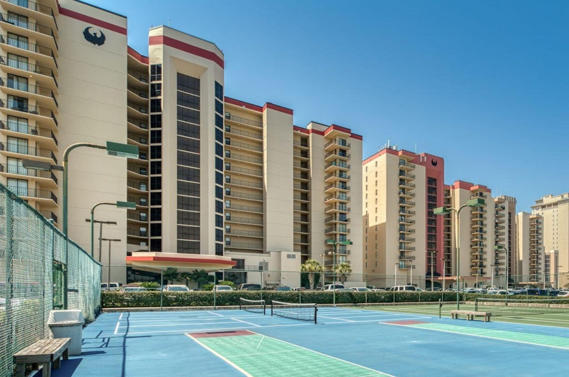 The outdoor tennis courts in front of Phoenix I in Orange Beach Alabama