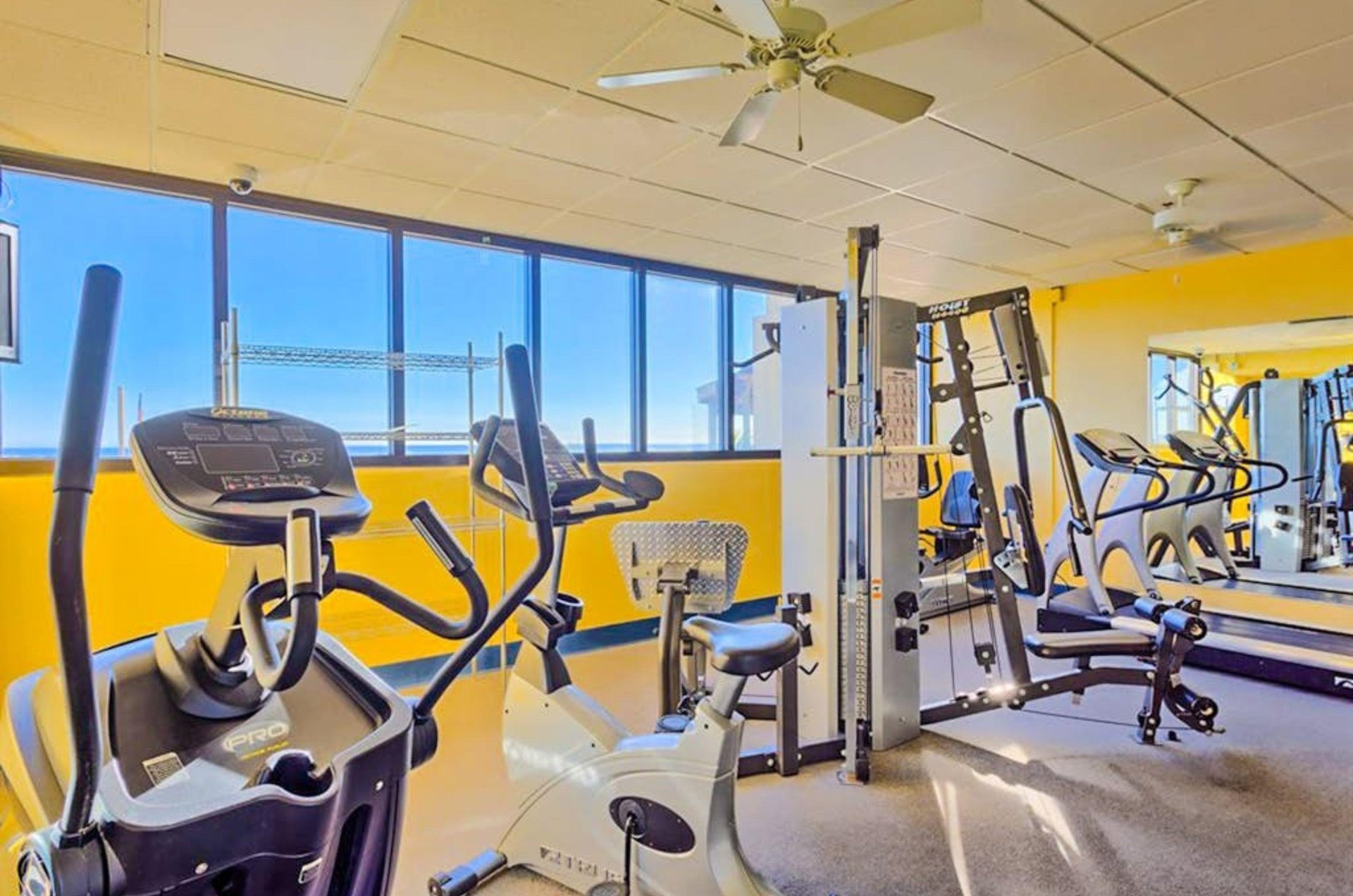 Strength and cardio equipment in the fitness center at Phoenix III in Orange Beach Alabama