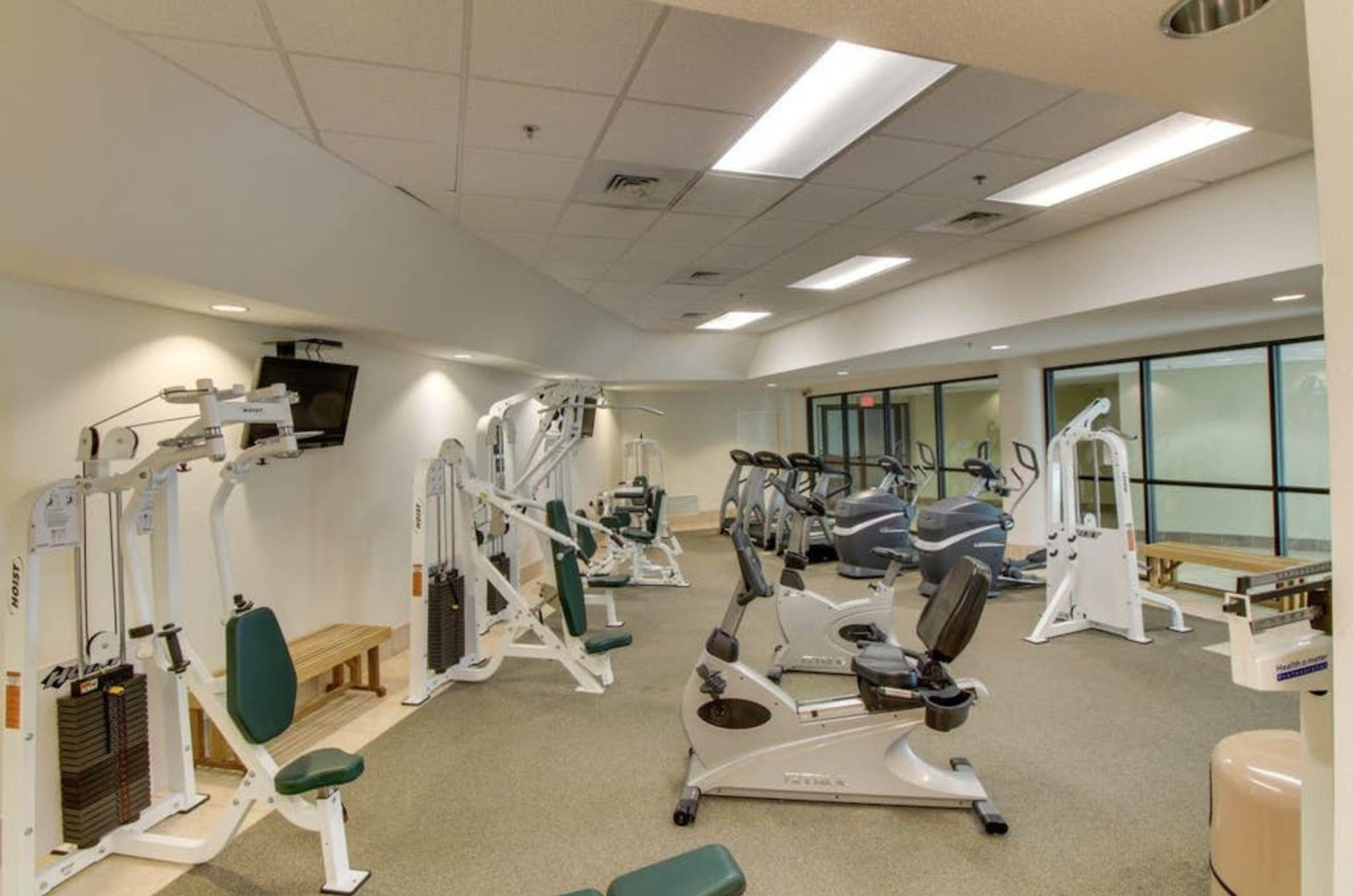 The onsite fitness center with cardio and strength equipment at Phoenix on the Bay