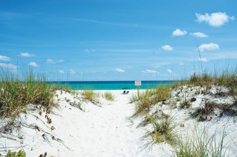 Gorgeous white sandy beach in front of Gulf Winds in Pensacola Beach FL