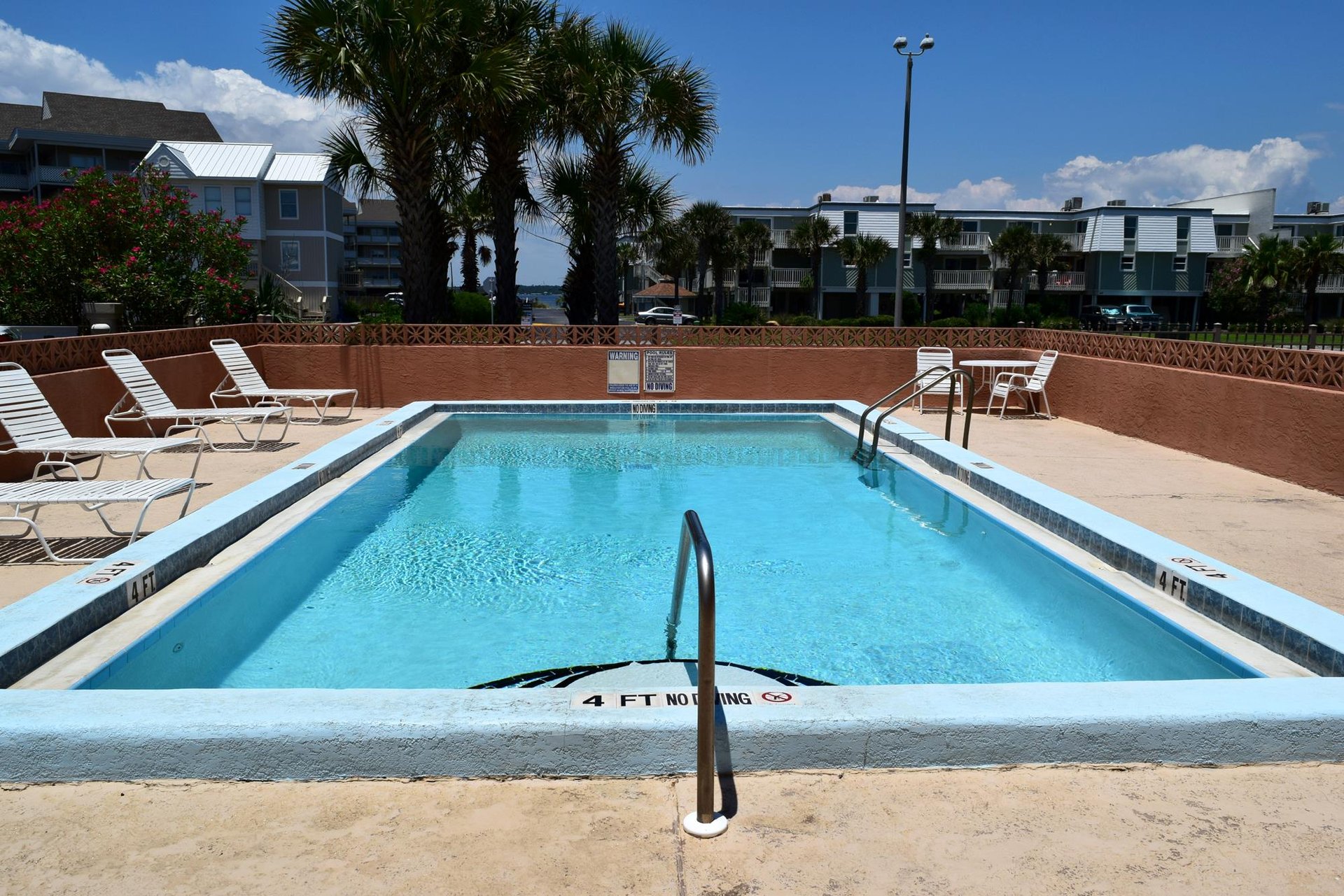 Enjoy the spacious pool deck only steps away from the beach