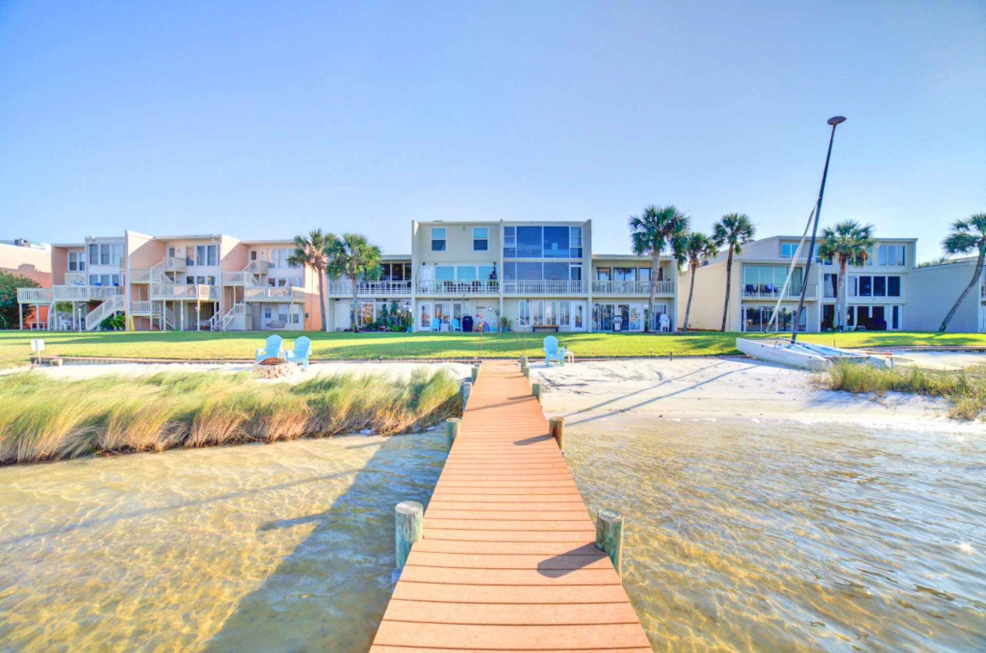 View from the bay of Treehouse Townhomes and the small pier leading towards the bay