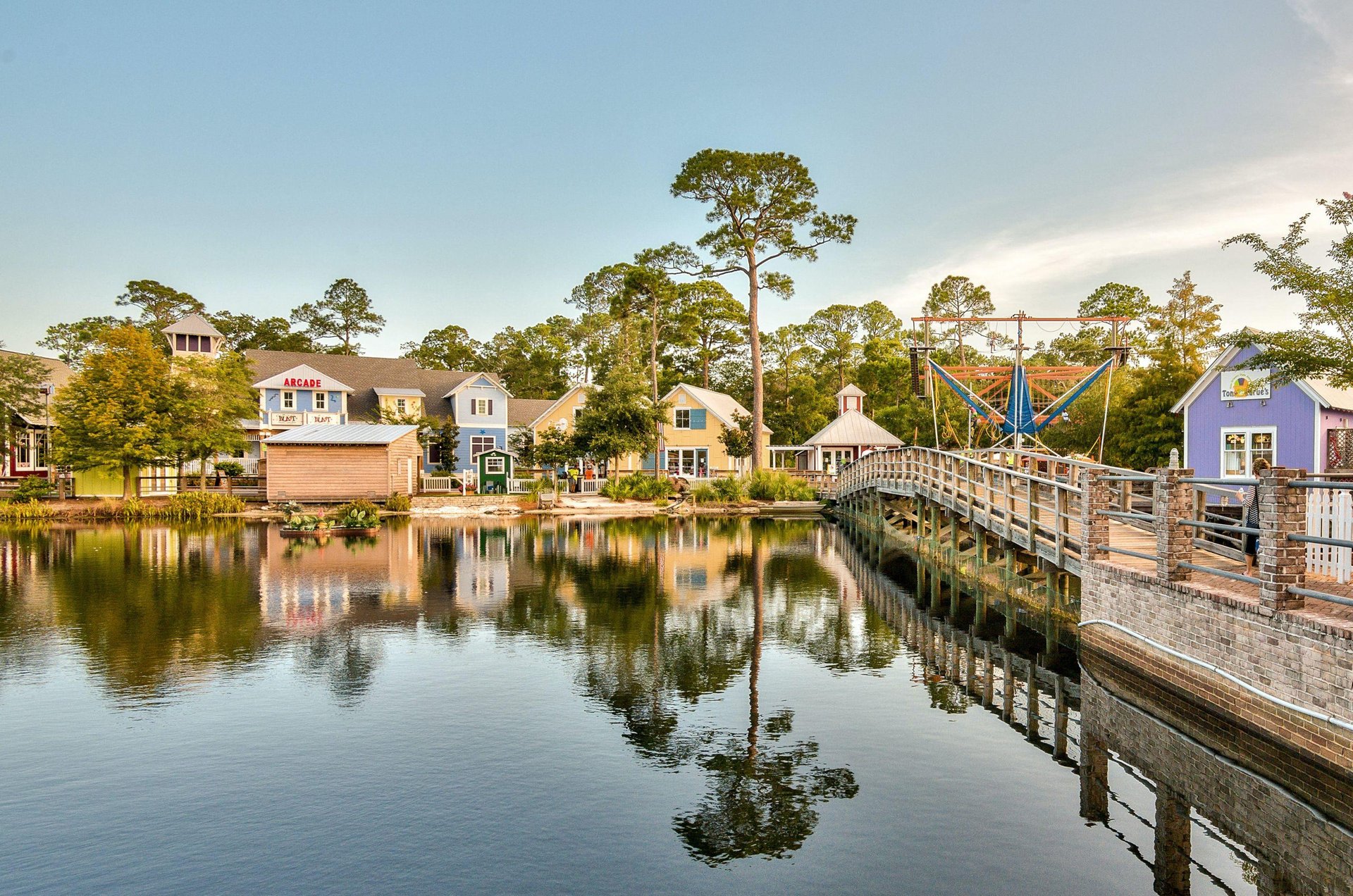 A scenic view of one of the resorts lakes and retail shops.