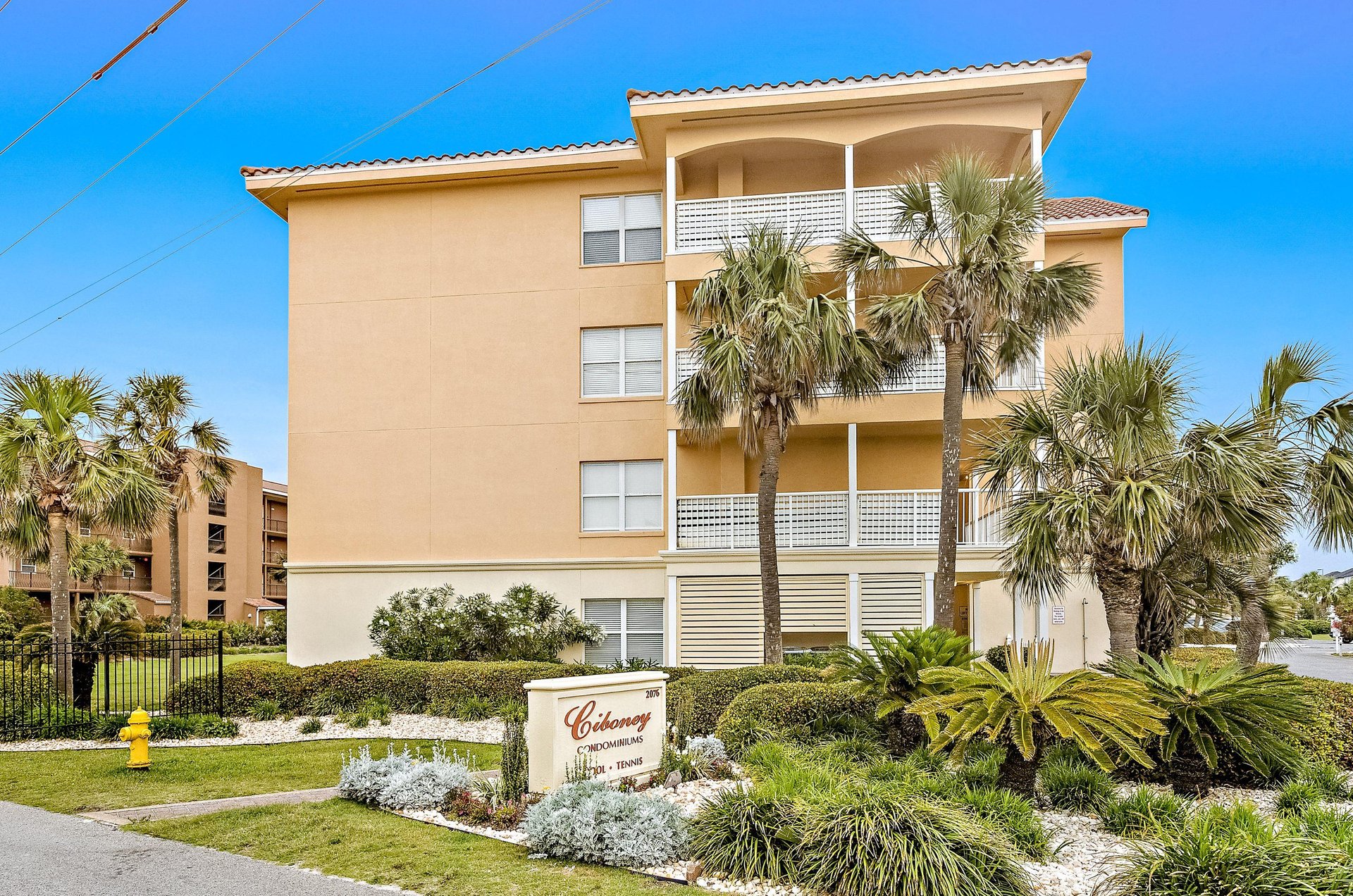 Ciboneys sign saying the property has a pool and tennis courts.