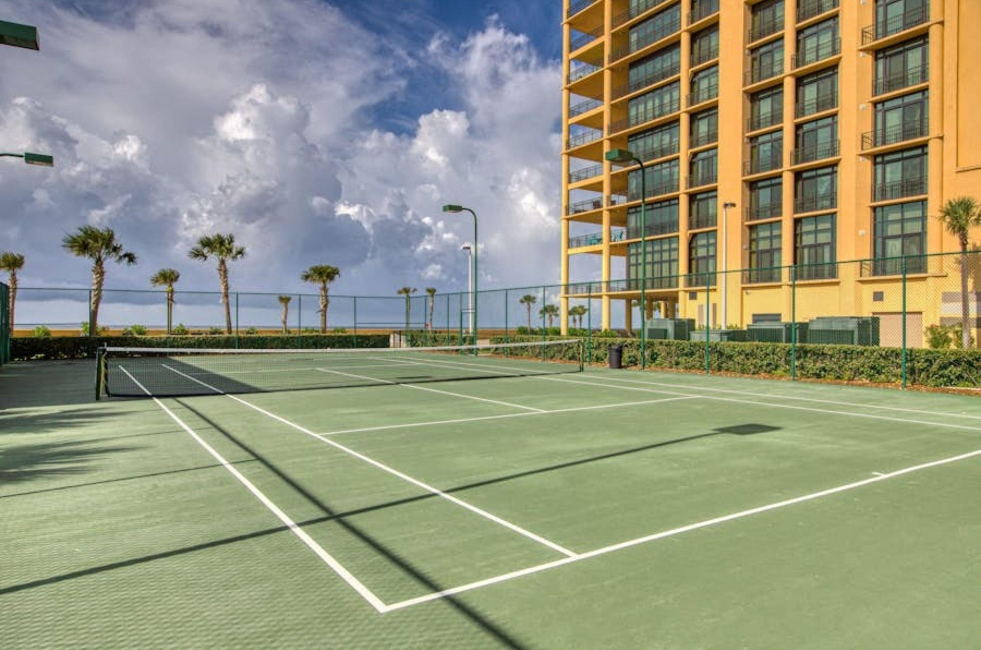 The outdoor tennis courts next to Phoenix West II in Orange Beach Alabama
