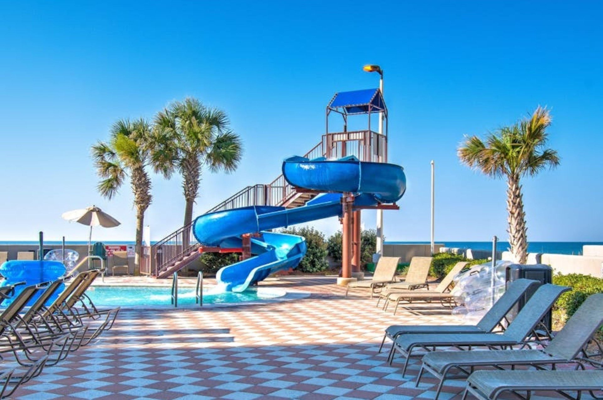 The waterslide on the pool deck at Phoenix West II in Orange Beach Alabama