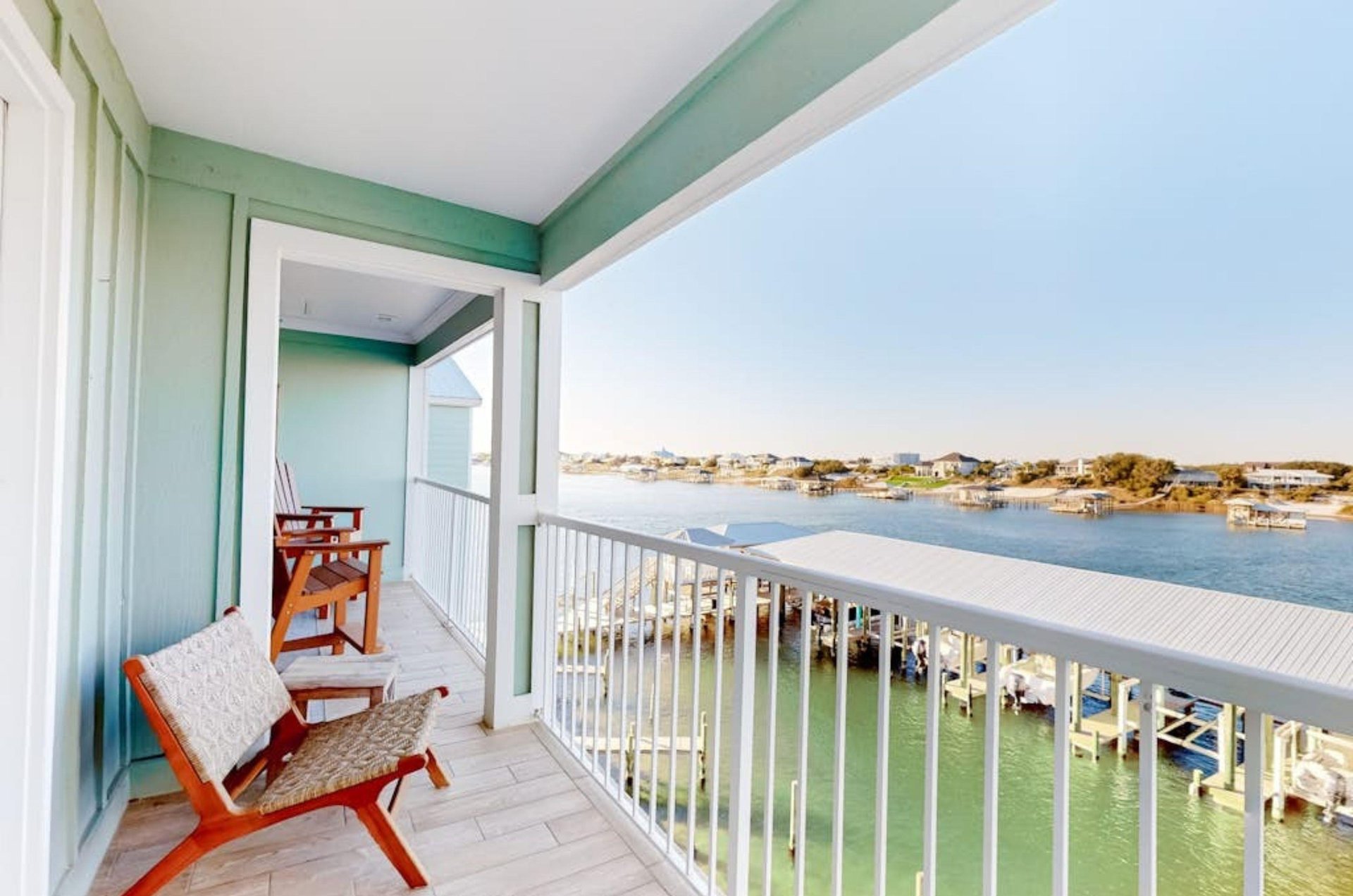 A private balcony with a bench overlooking the water at Jubilee Landing in Orange Beach Alabama