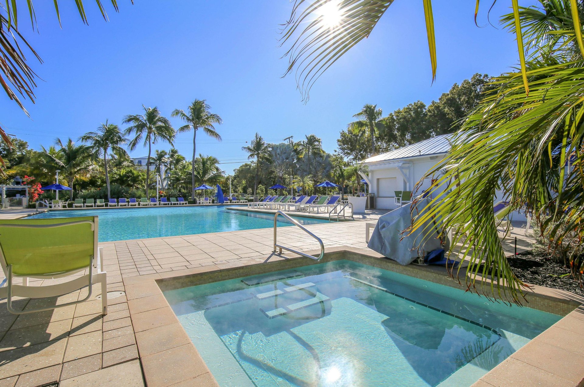 A Key Largo swimming pool and hot tub under bluebird skies.
