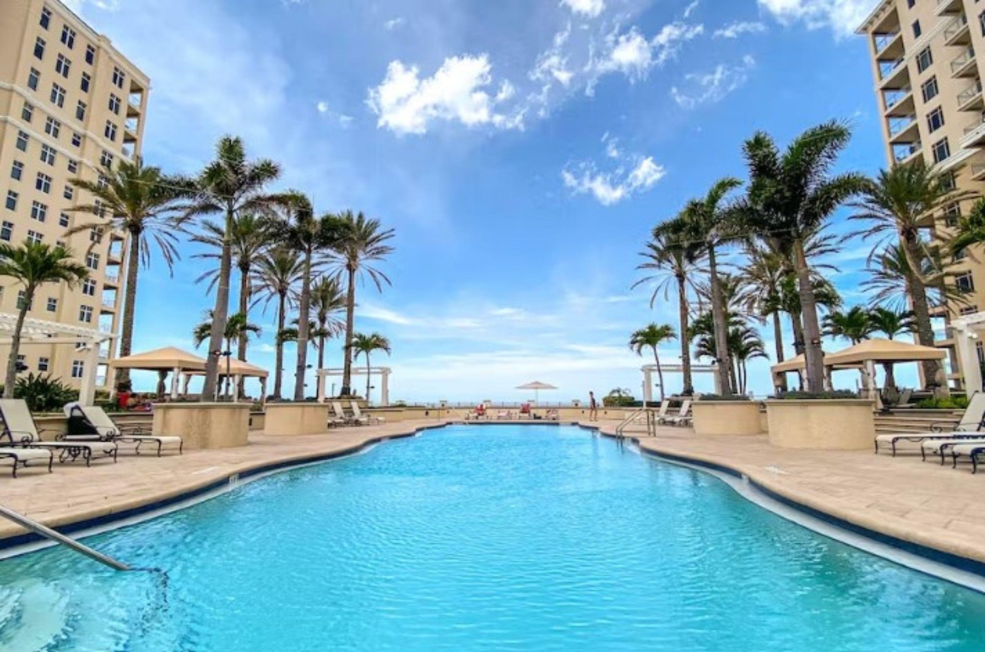 A beautiful swimming pool and sundeck in one of Clearwaters many luxury condo complexes.