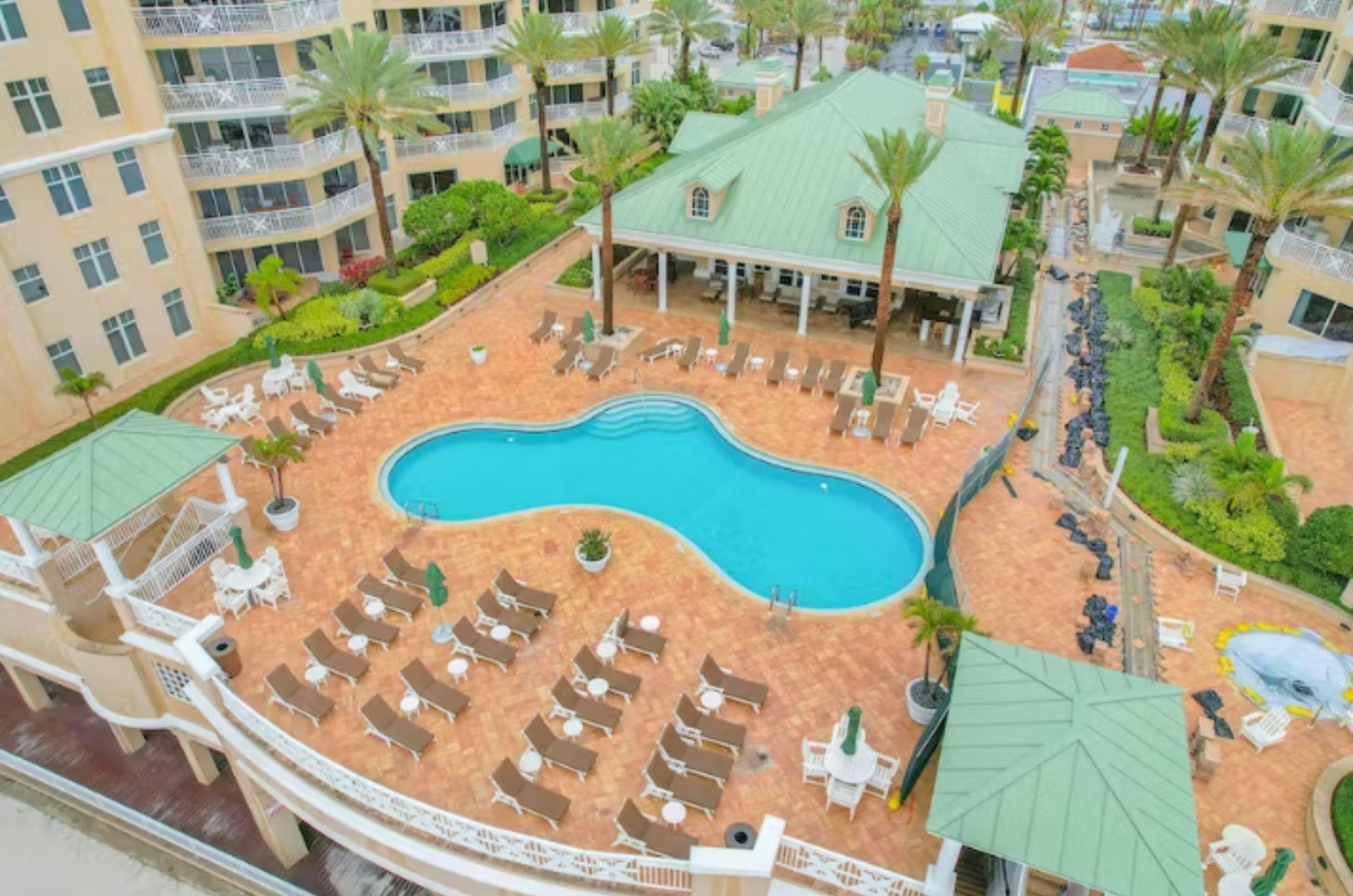 A picturesque swimming pool and sundeck in one of Clearwaters many luxurious condo complexes.