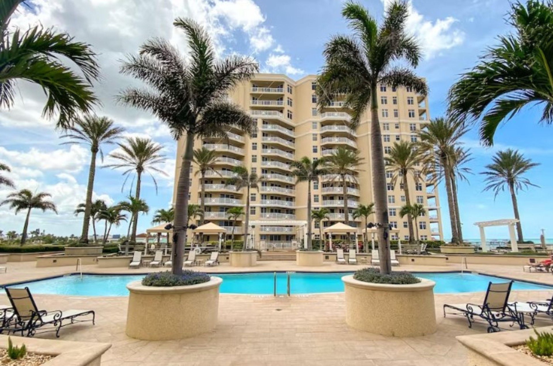 One of Clearwater Beachs luxurious highrise condo complexes with a glistening swimming pool and spacious sundeck.