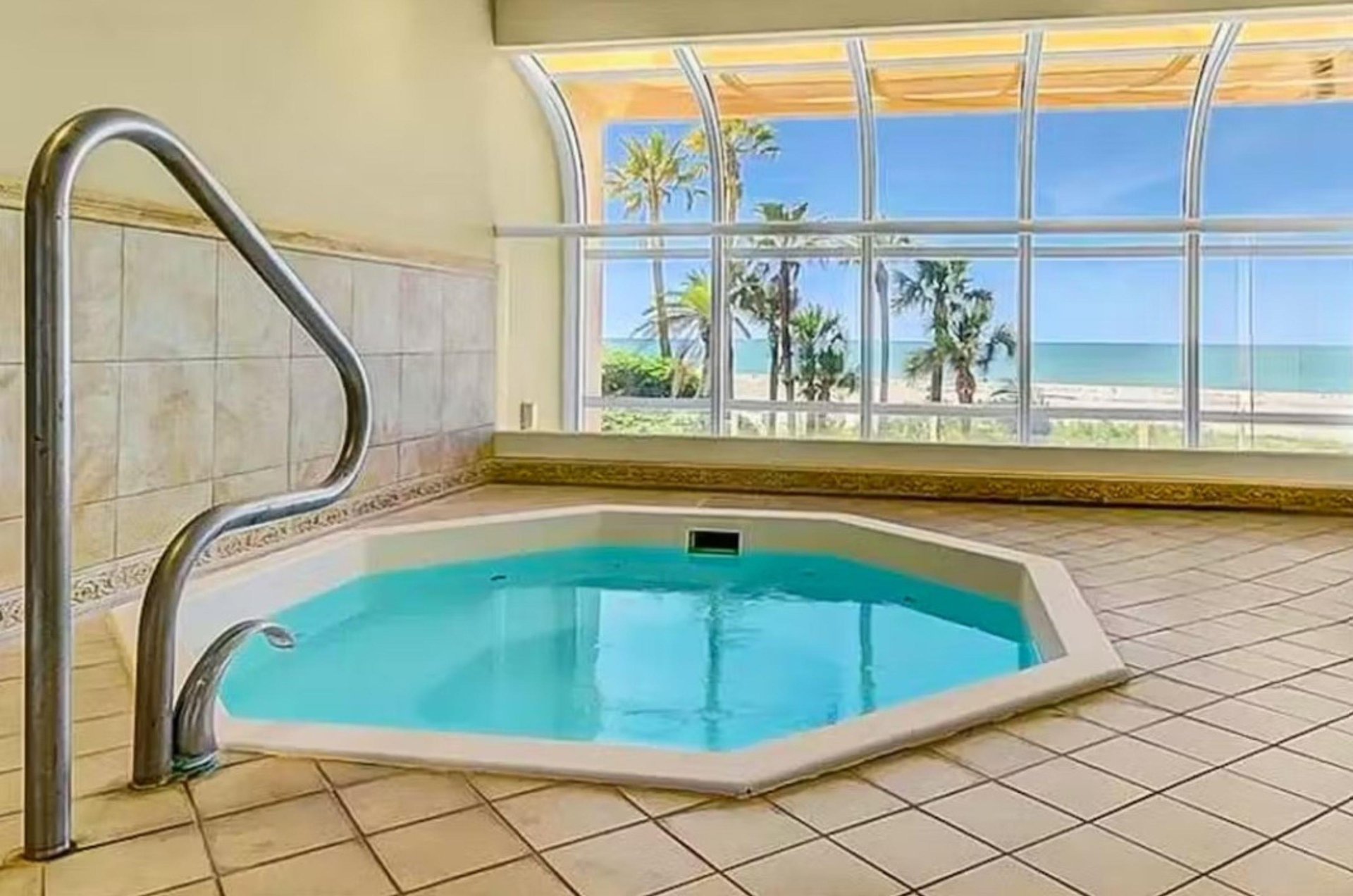 The resorts indoor hot tub looks out over the beach.