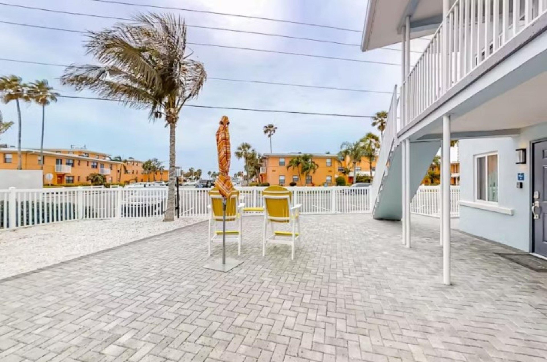 Tropical breezes blow through towering palms.